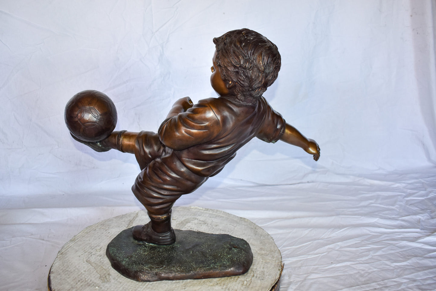 Young Boy Passionately Kicking Soccer Ball Bronze Statue  Size: 26" x 16" x 24"H