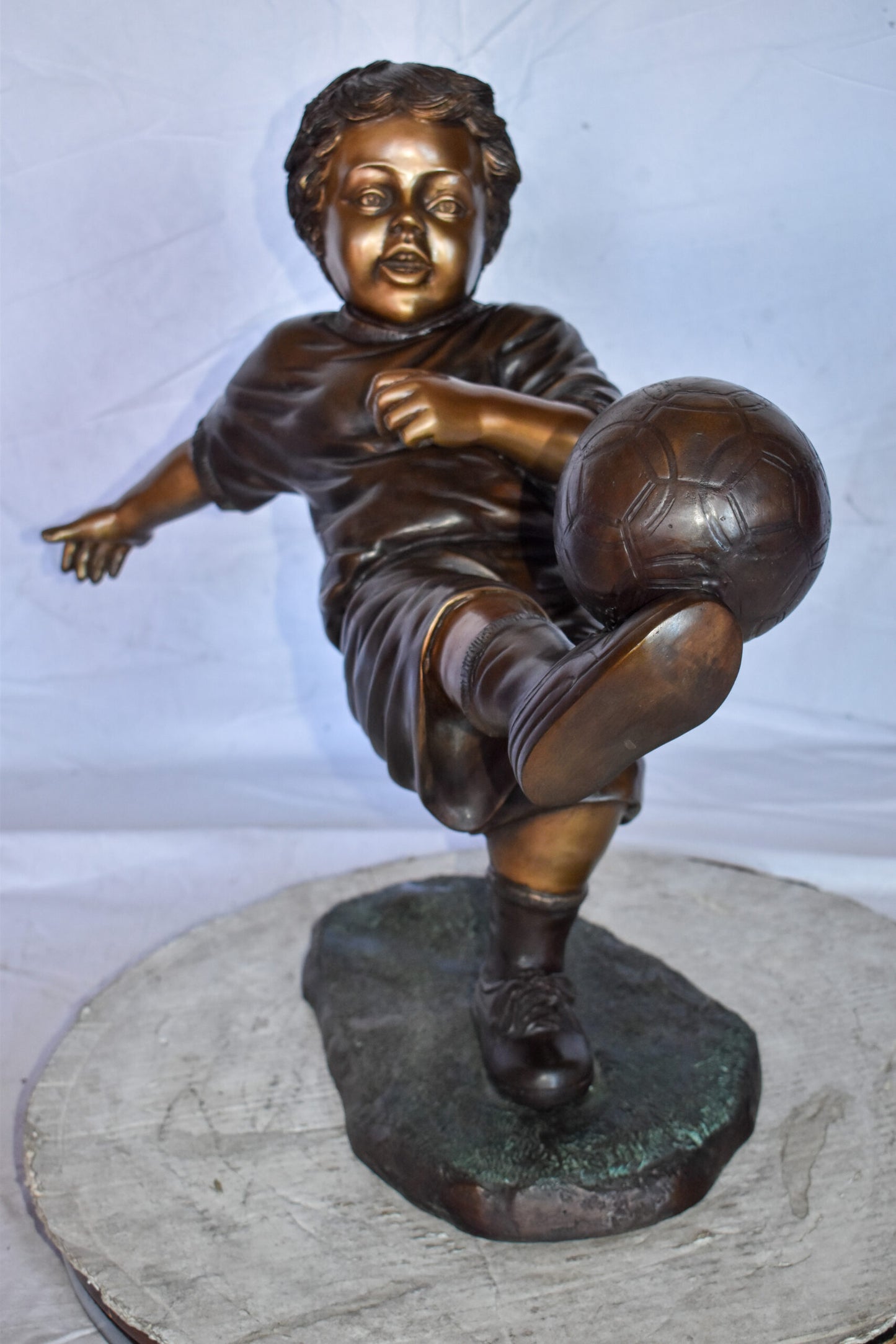 Young Boy Passionately Kicking Soccer Ball Bronze Statue  Size: 26" x 16" x 24"H