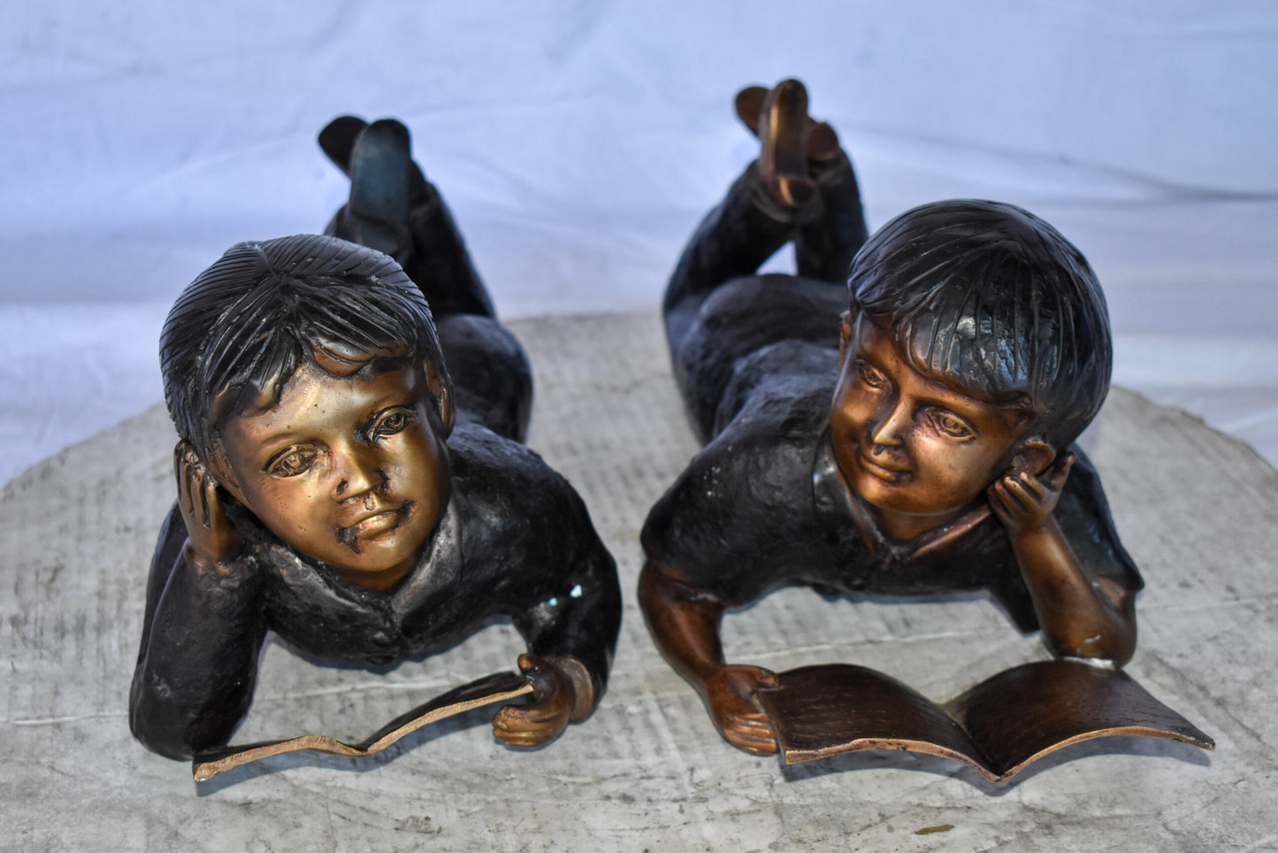Young Kids Laying and Reading Cheerfully Bronze Statue Set Size: 20" x 13" x 8"H