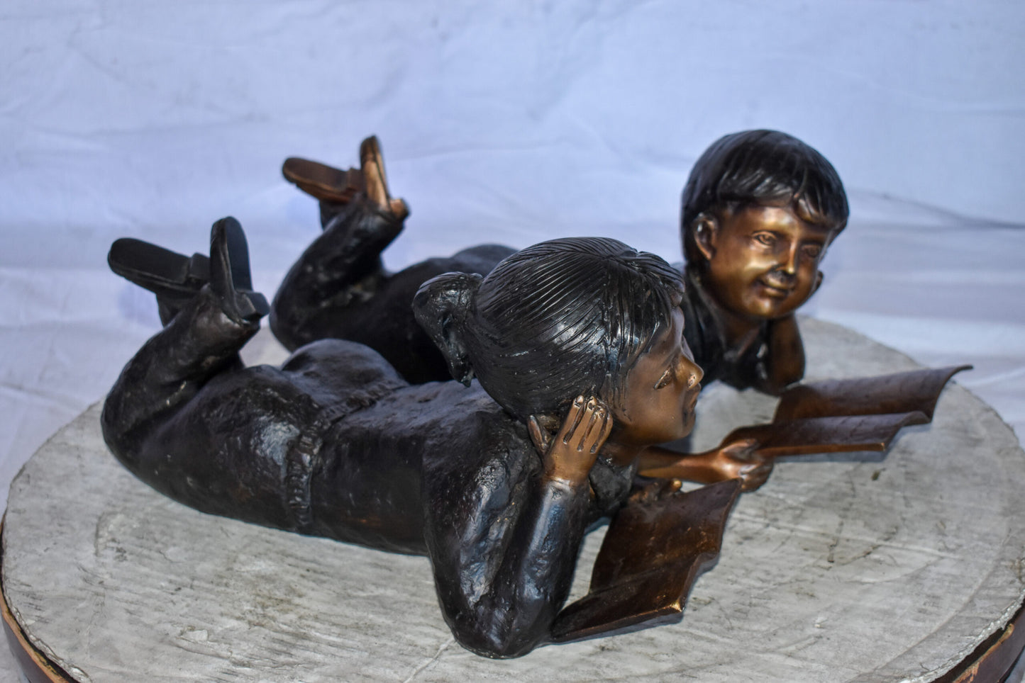 Young Kids Laying and Reading Cheerfully Bronze Statue Set Size: 20" x 13" x 8"H