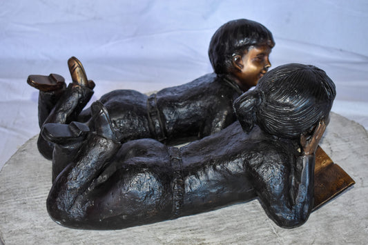 Young Kids Laying and Reading Cheerfully Bronze Statue Set Size: 20" x 13" x 8"H