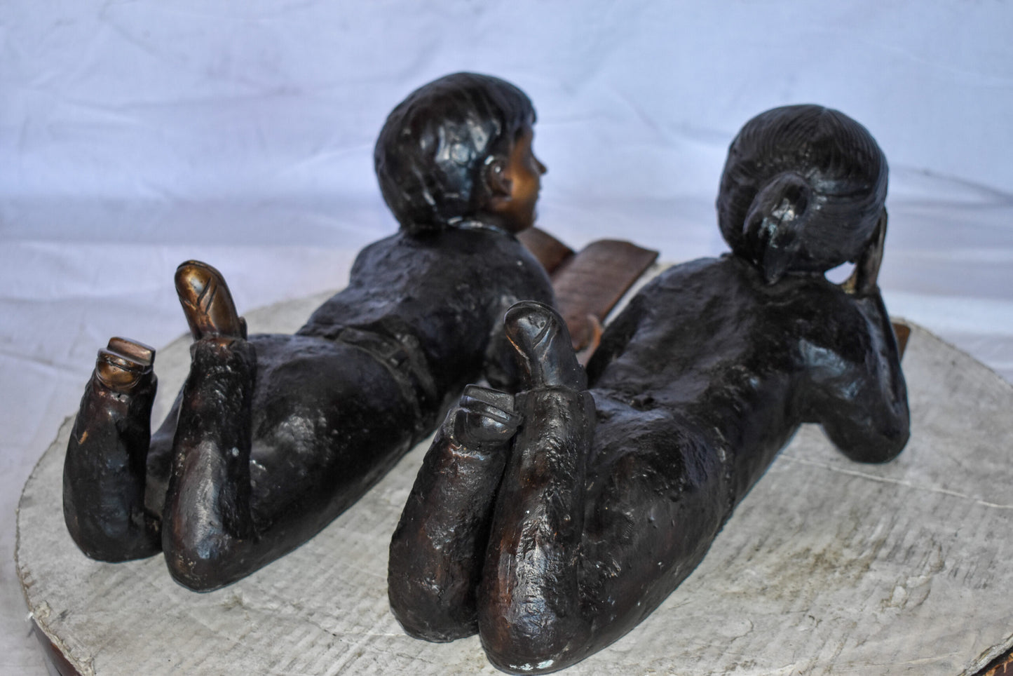 Young Kids Laying and Reading Cheerfully Bronze Statue Set Size: 20" x 13" x 8"H