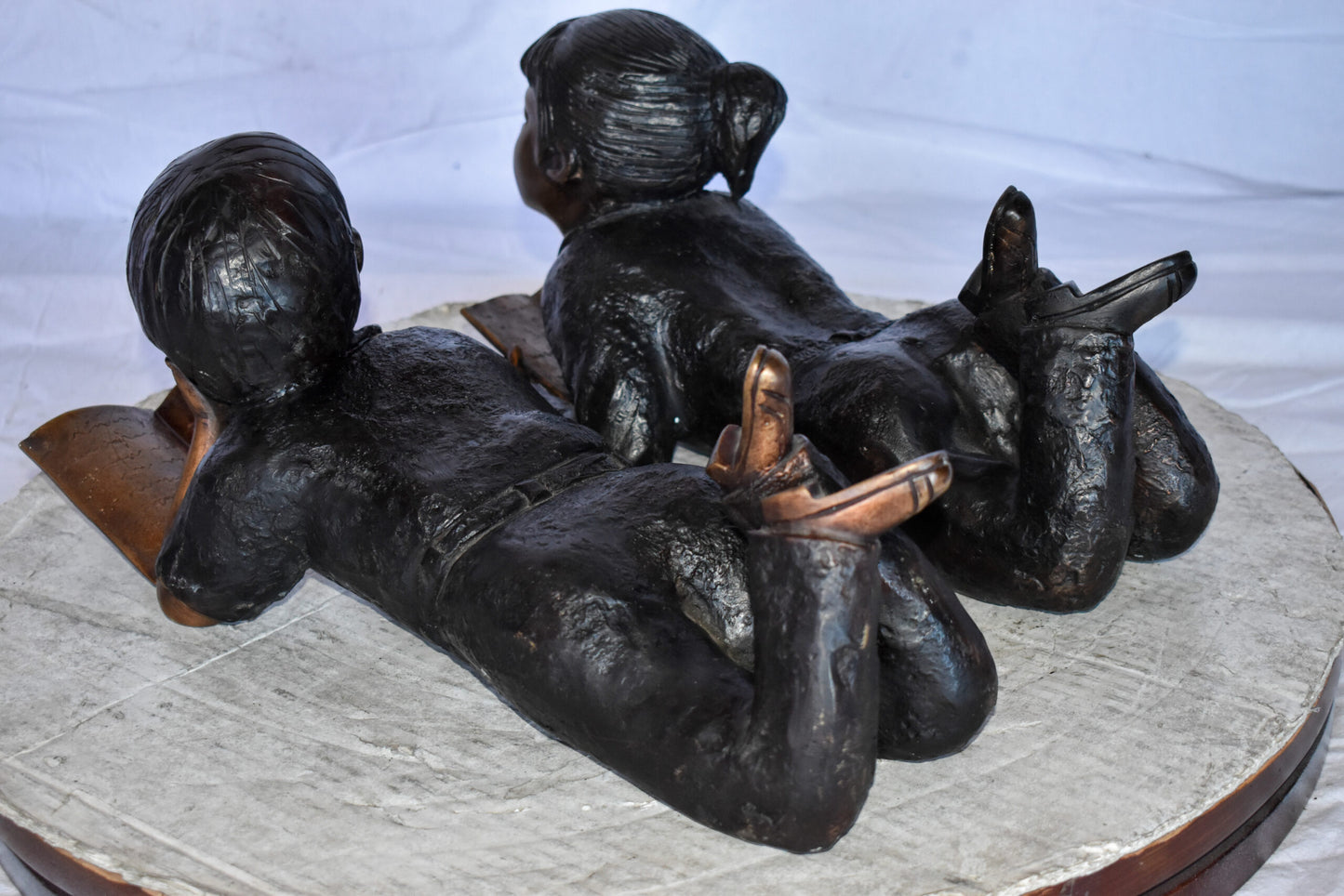 Young Kids Laying and Reading Cheerfully Bronze Statue Set Size: 20" x 13" x 8"H