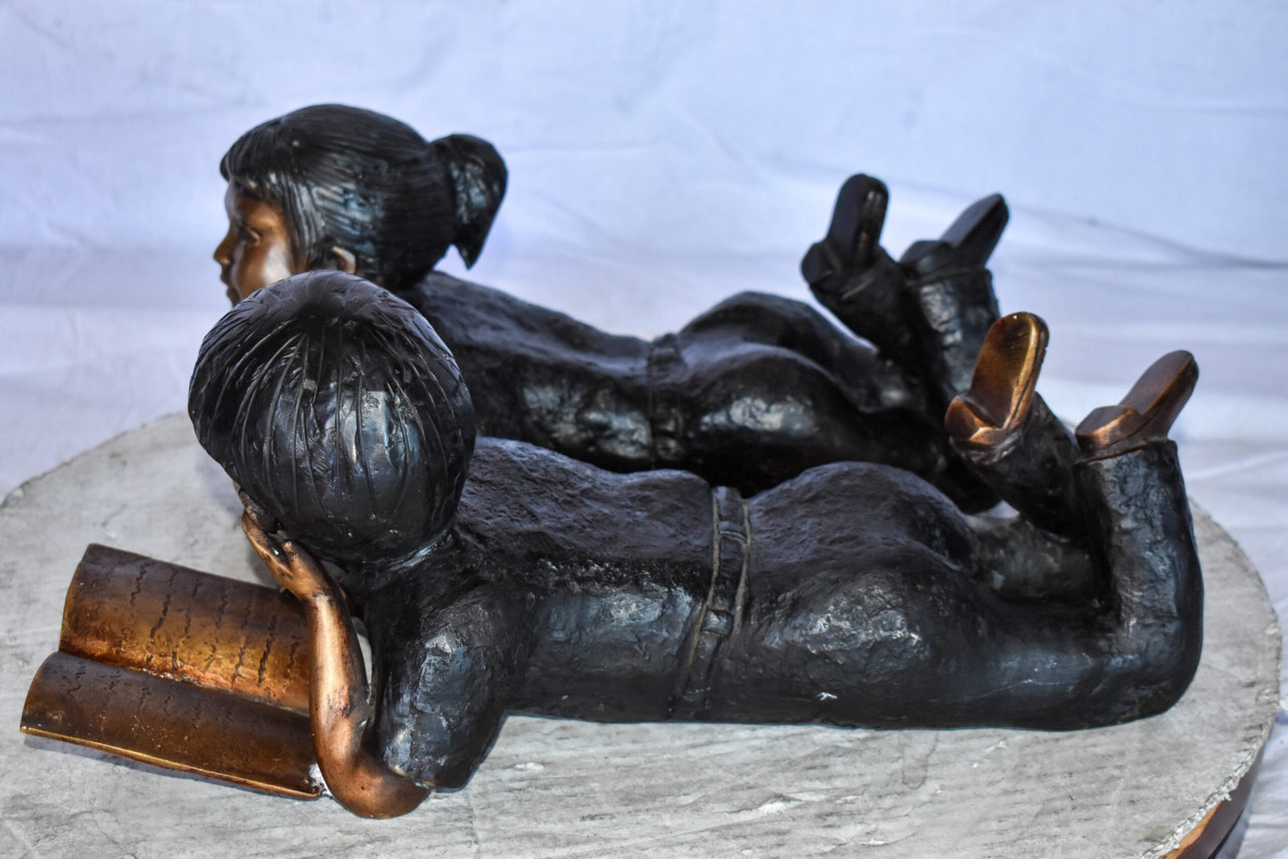 Young Kids Laying and Reading Cheerfully Bronze Statue Set Size: 20" x 13" x 8"H