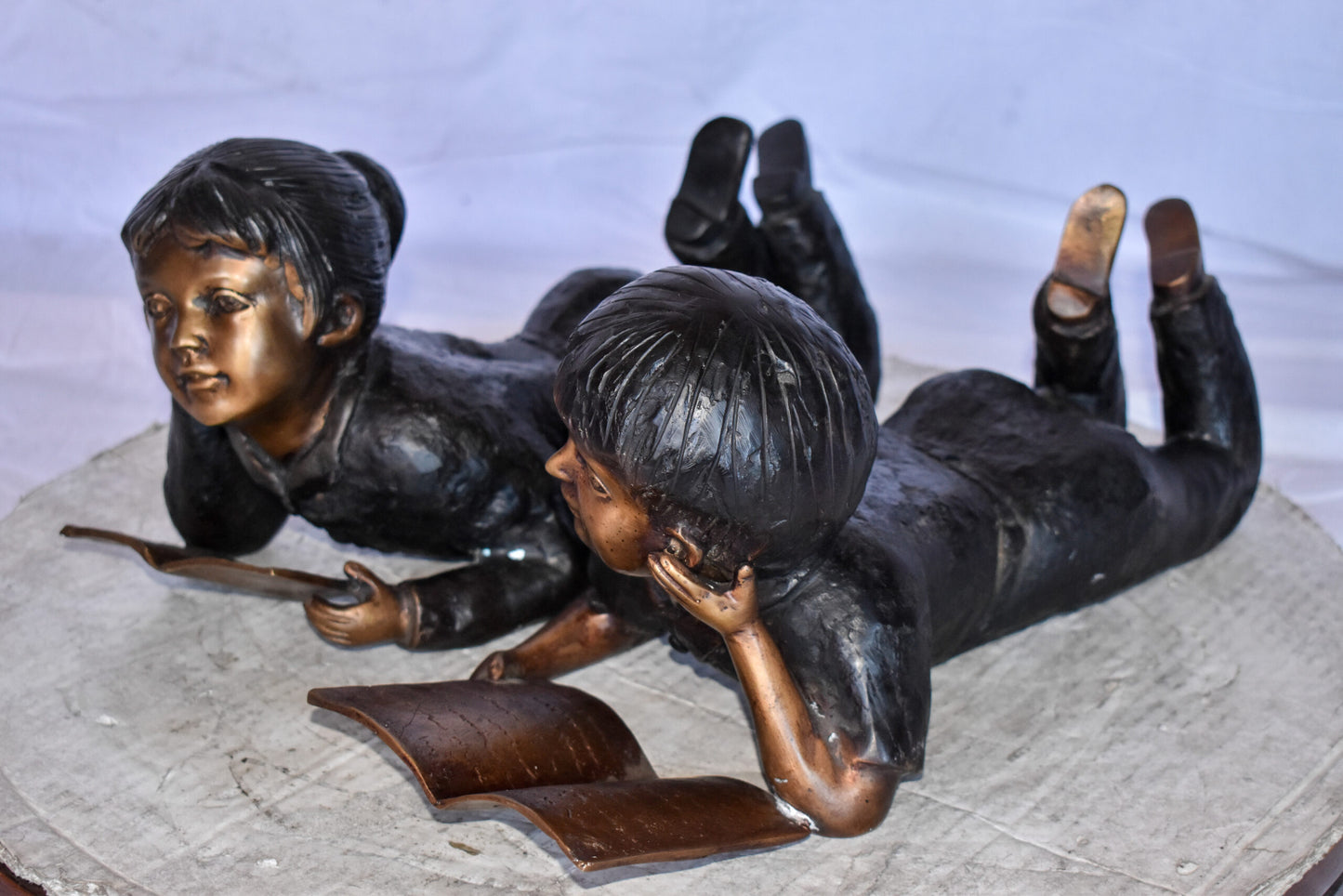 Young Kids Laying and Reading Cheerfully Bronze Statue Set Size: 20" x 13" x 8"H