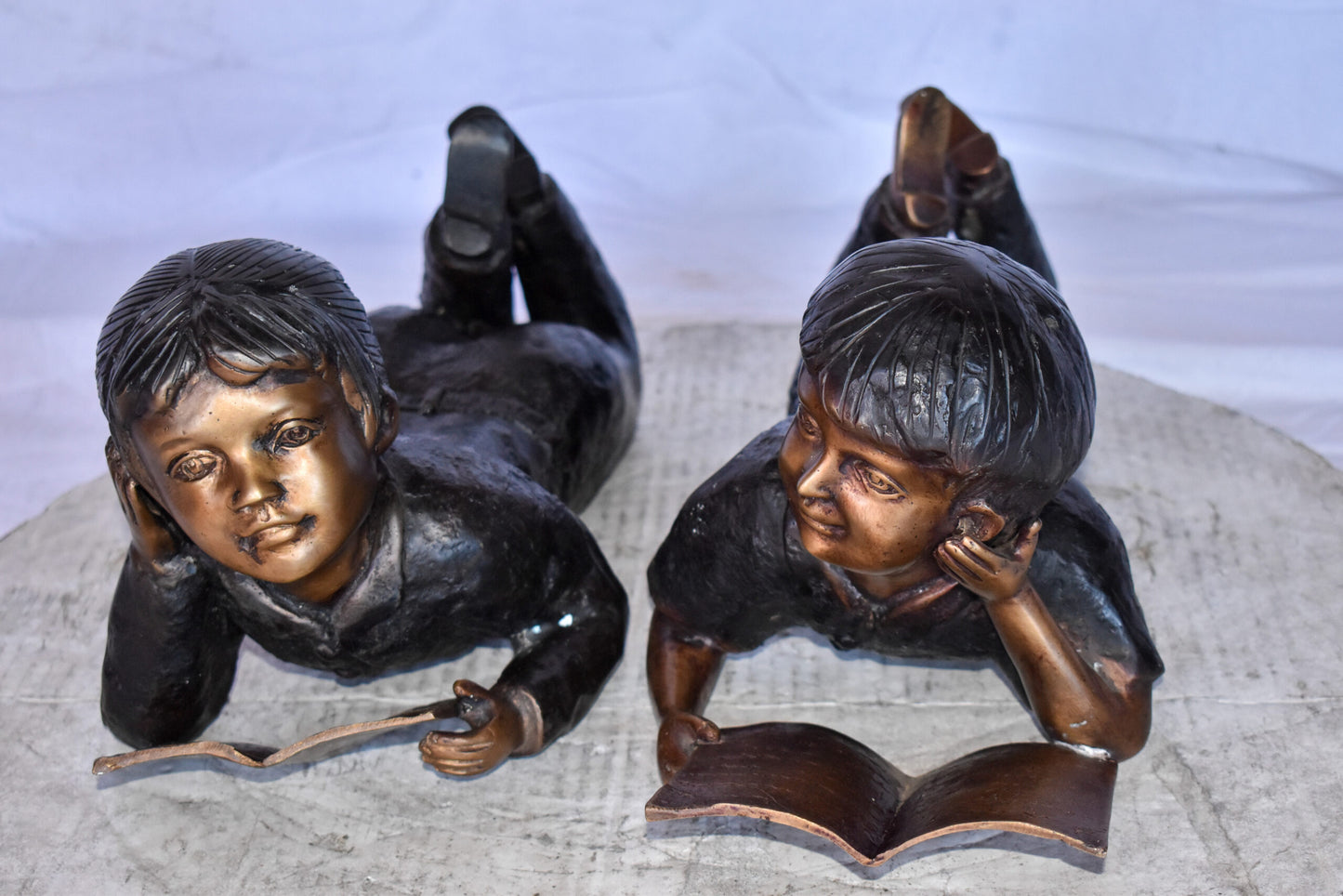 Young Kids Laying and Reading Cheerfully Bronze Statue Set Size: 20" x 13" x 8"H