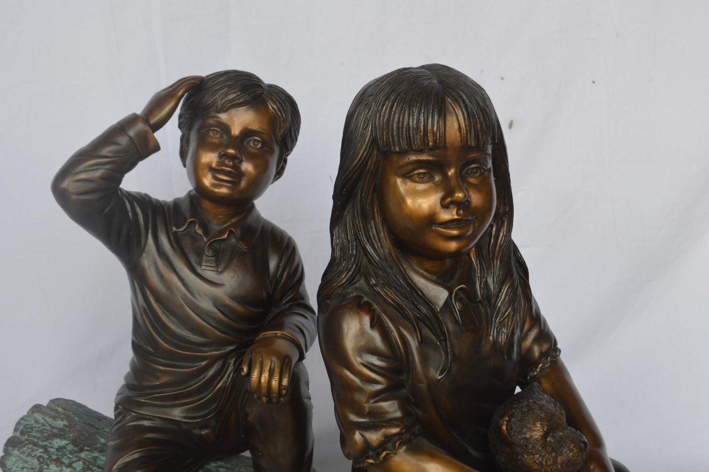 Young children and dog on a log bronze statue - Size: 40"L x 16"W x 24"H.