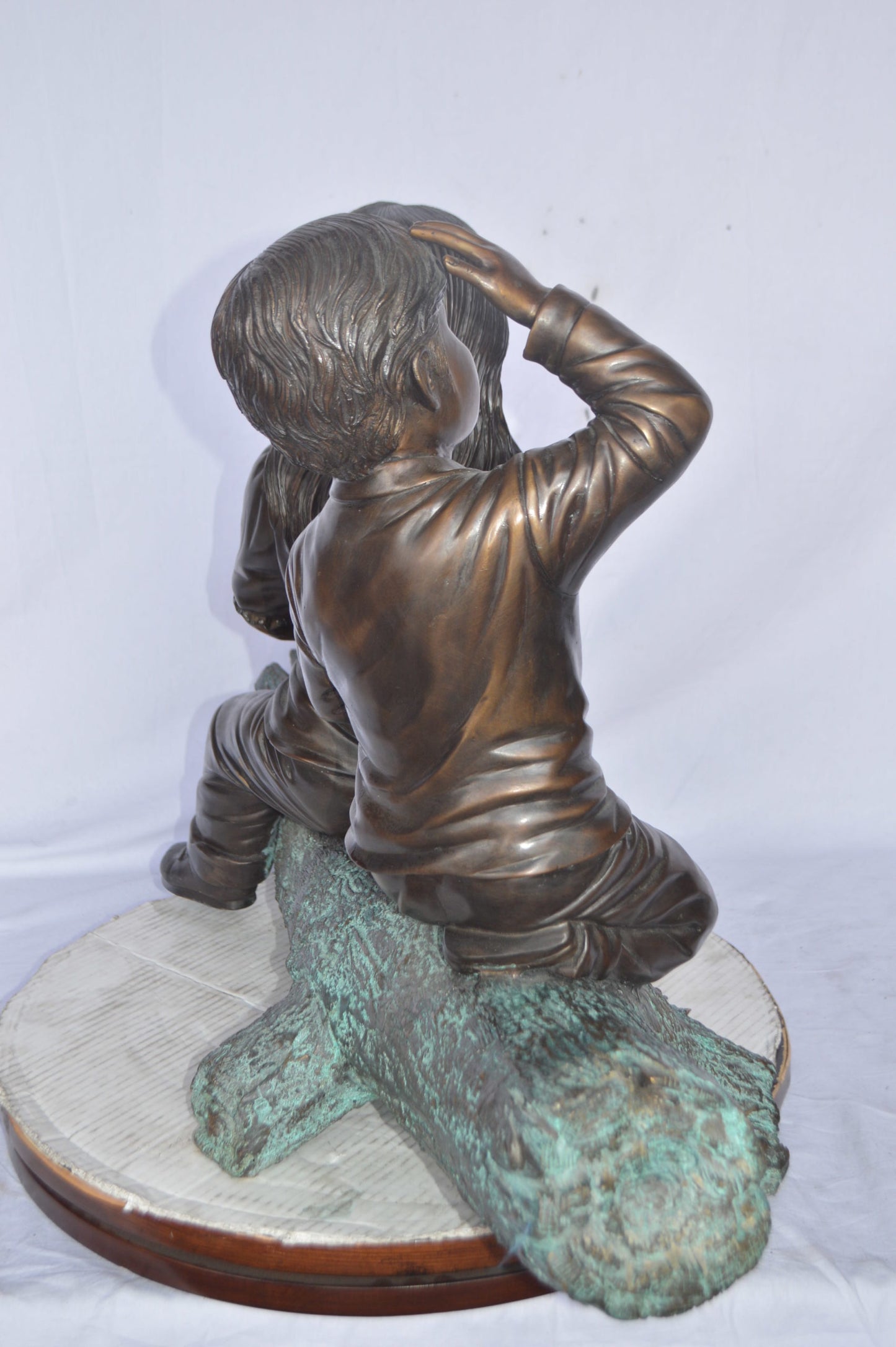 Young children and dog on a log bronze statue - Size: 40"L x 16"W x 24"H.