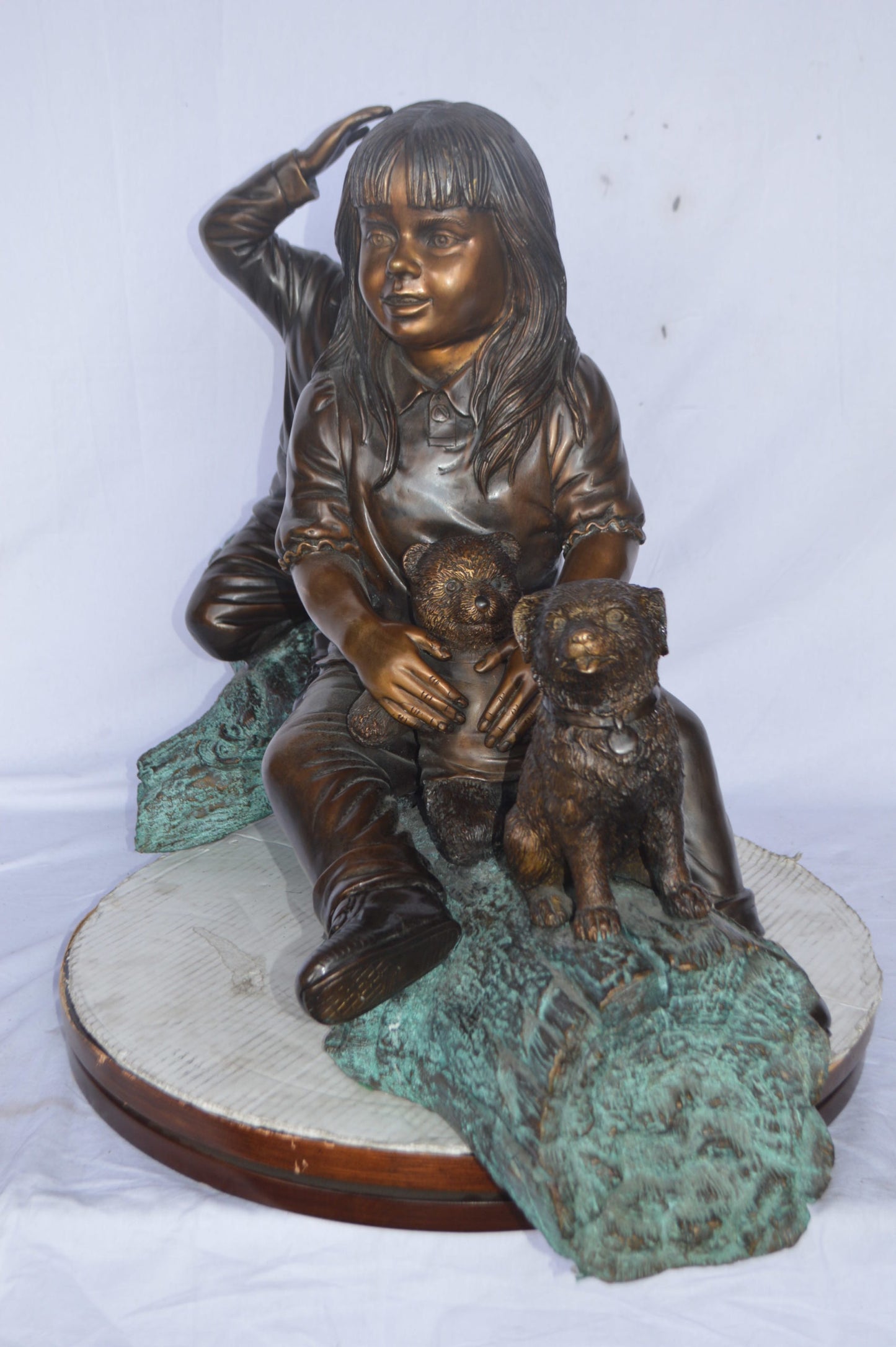 Young children and dog on a log bronze statue - Size: 40"L x 16"W x 24"H.