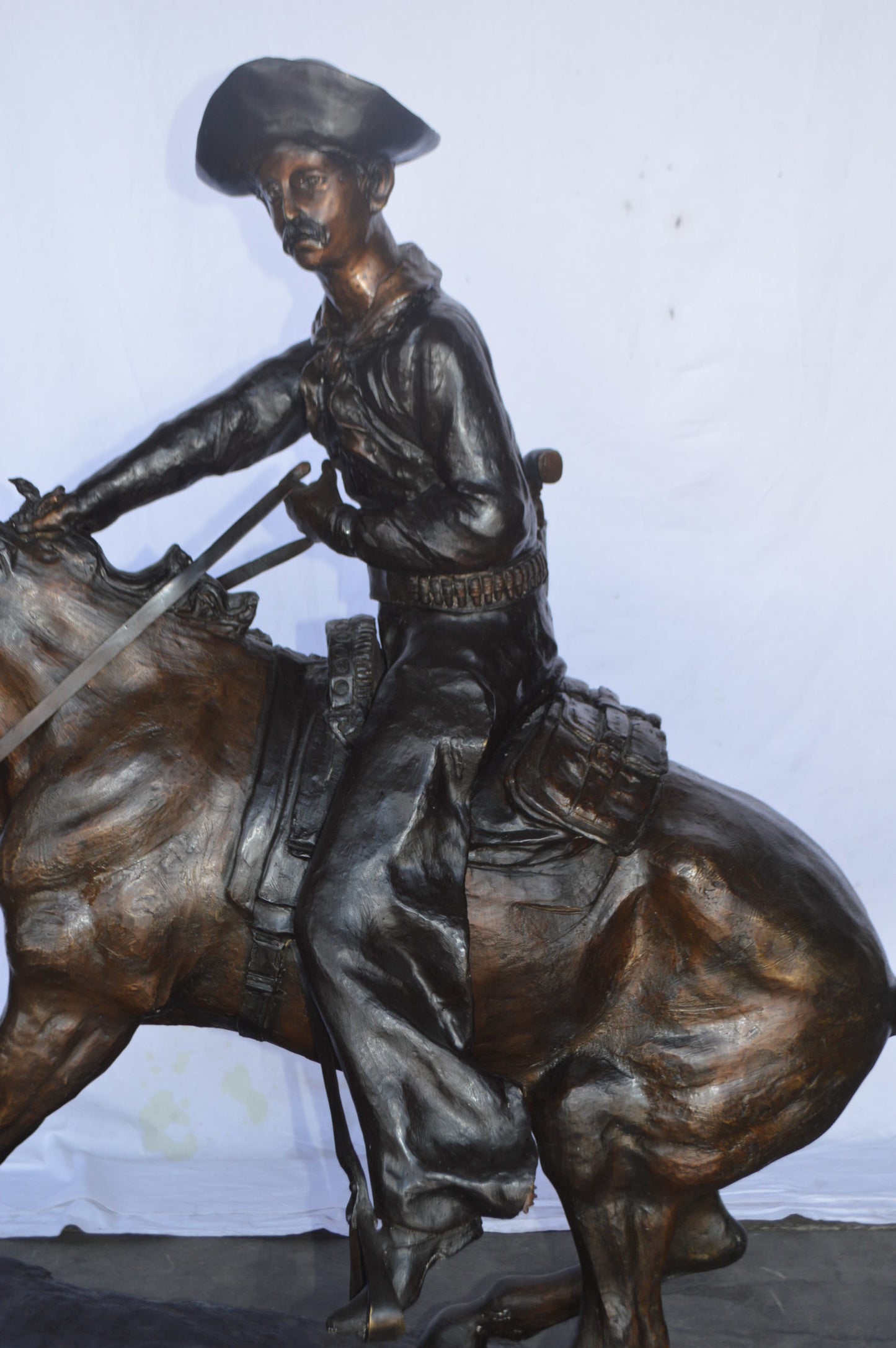 Giant Cowboy Remington bronze statue - Size: 66"L x 30"W x 58"H.