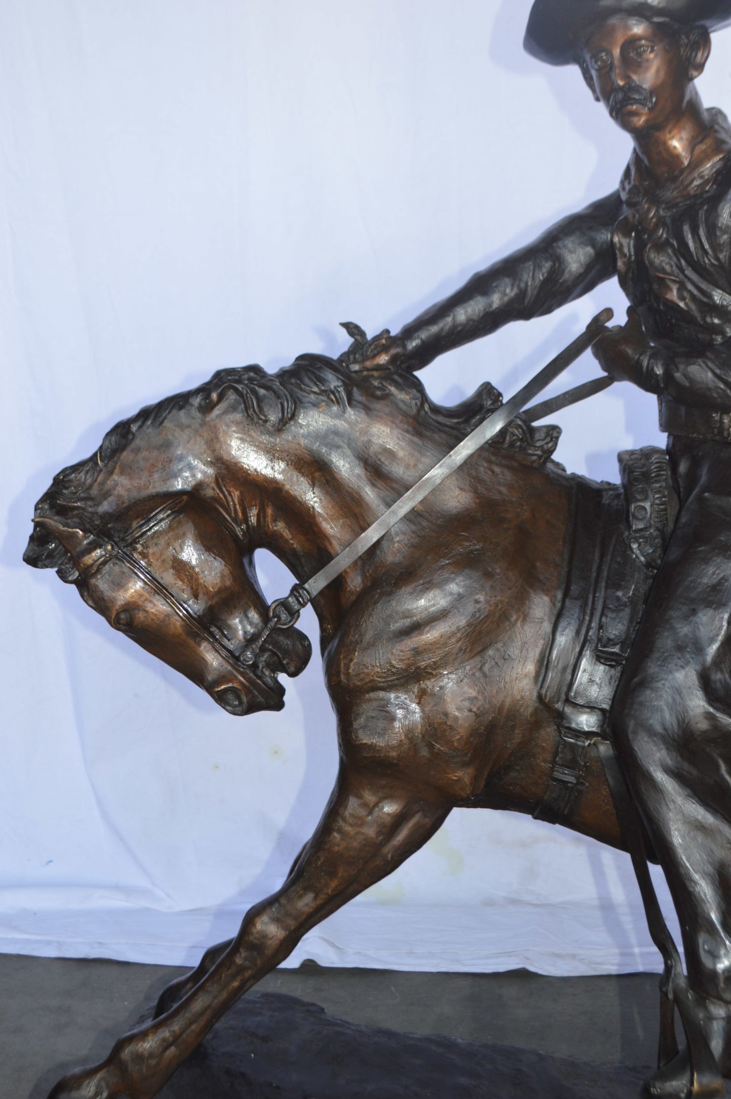 Giant Cowboy Remington bronze statue - Size: 66"L x 30"W x 58"H.