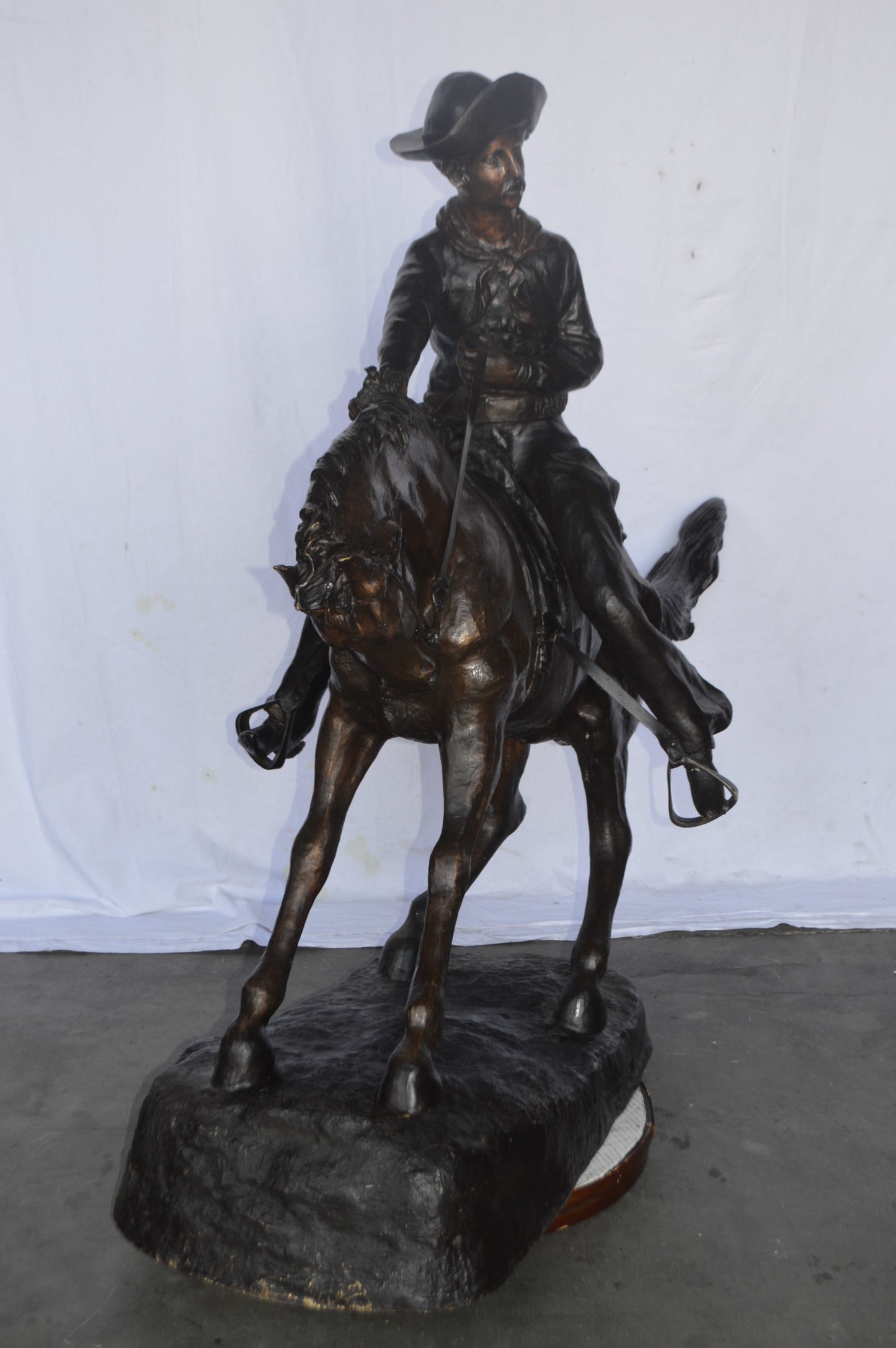 Giant Cowboy Remington bronze statue - Size: 66"L x 30"W x 58"H.