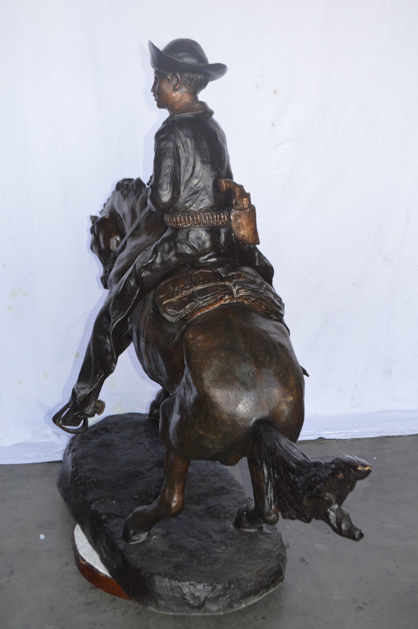 Giant Cowboy Remington bronze statue - Size: 66"L x 30"W x 58"H.