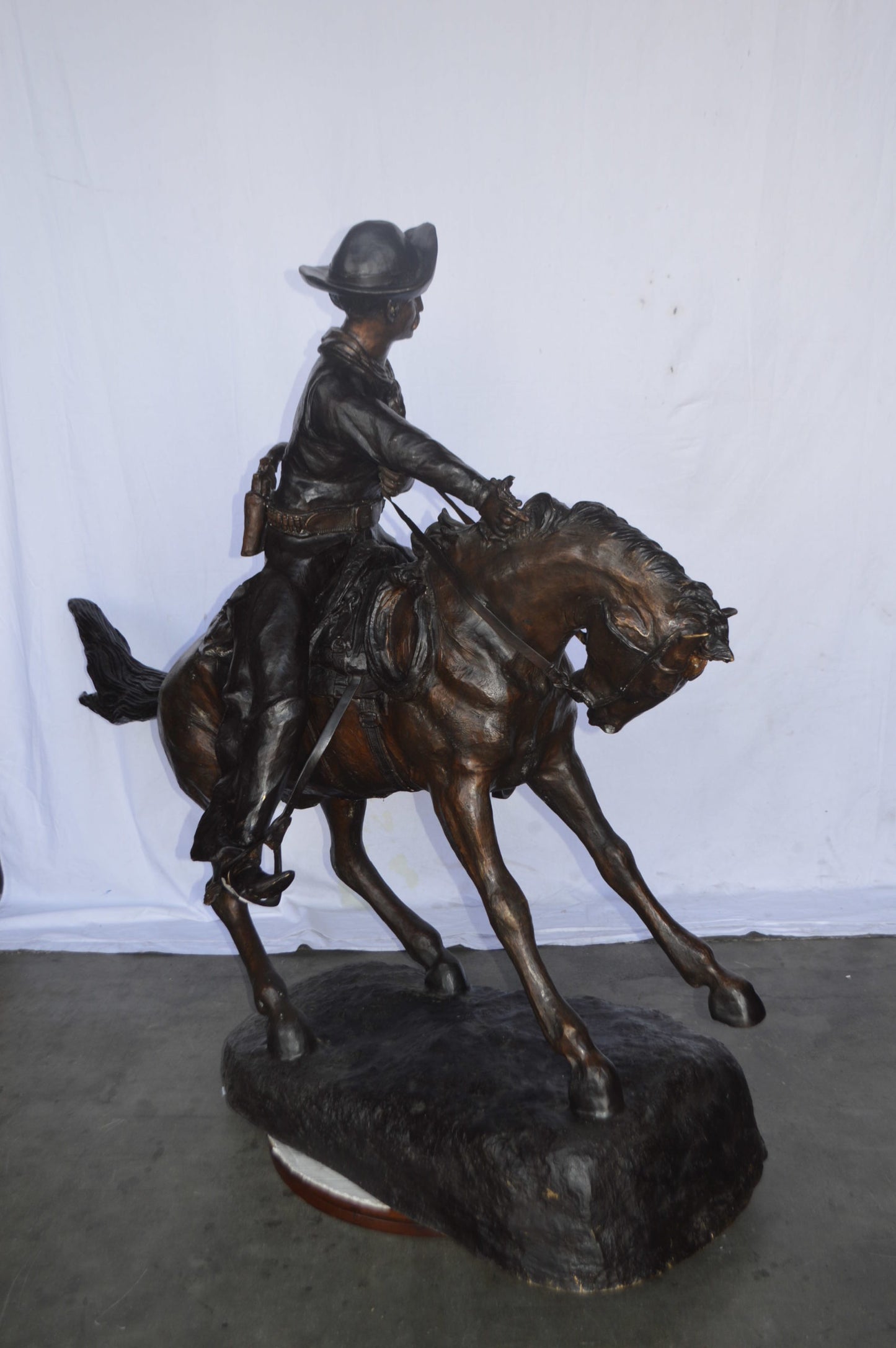 Giant Cowboy Remington bronze statue - Size: 66"L x 30"W x 58"H.