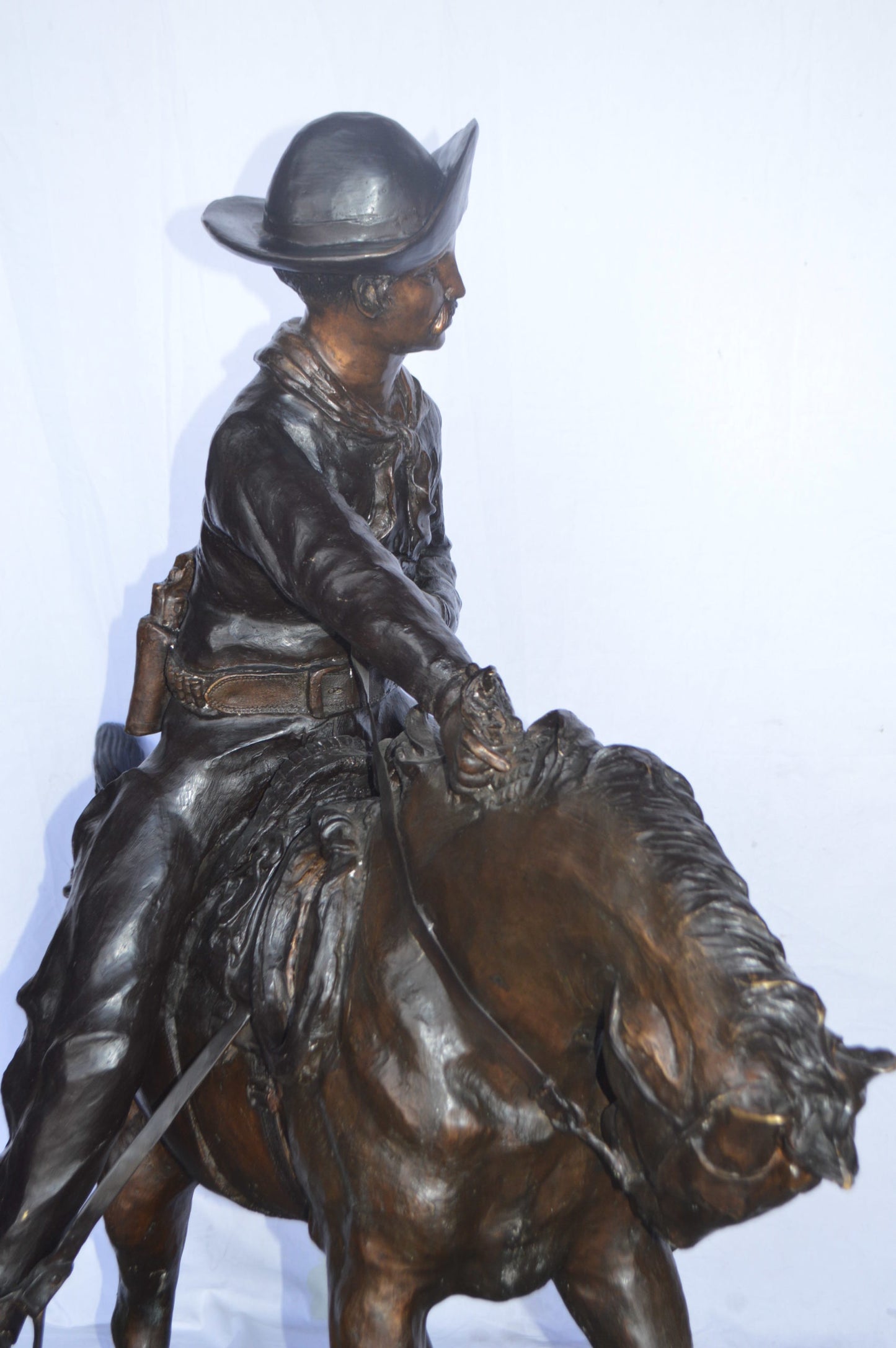 Giant Cowboy Remington bronze statue - Size: 66"L x 30"W x 58"H.