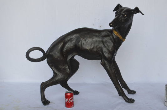 Whipped Dog bronze statue - Size: 33"L x 13"W x 30"H.