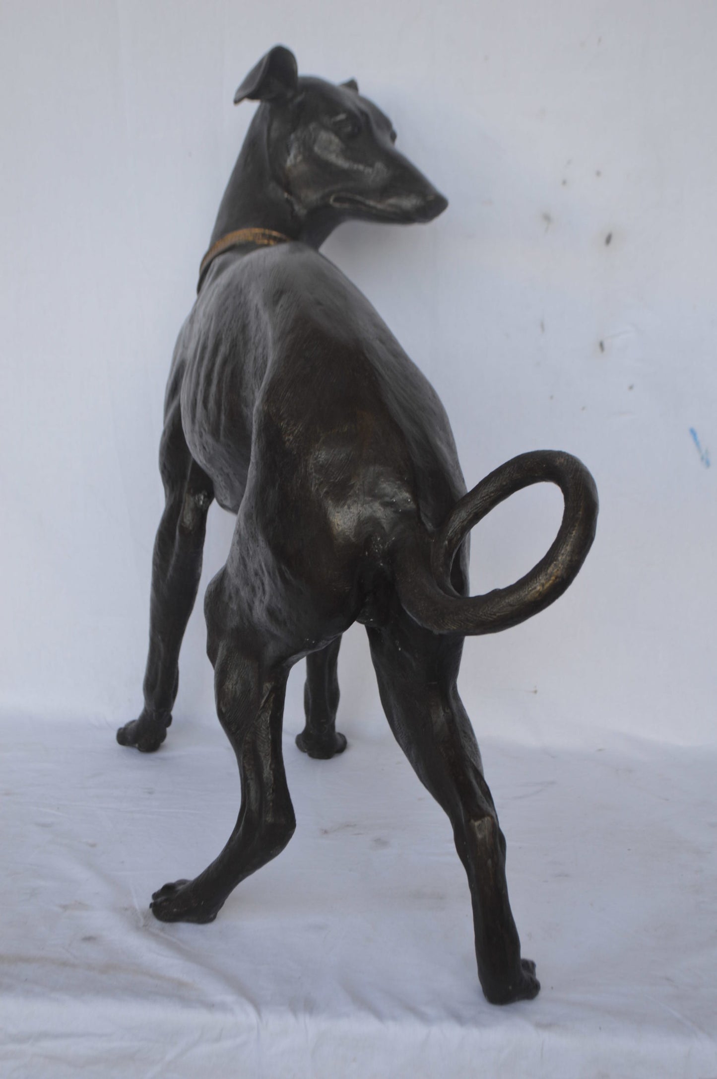 Whipped Dog bronze statue - Size: 33"L x 13"W x 30"H.
