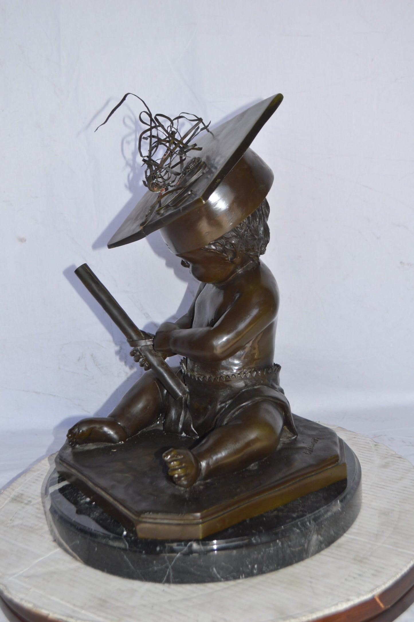 Graduating baby bronze statue - Size: 16"L x 16"W x 21"H.