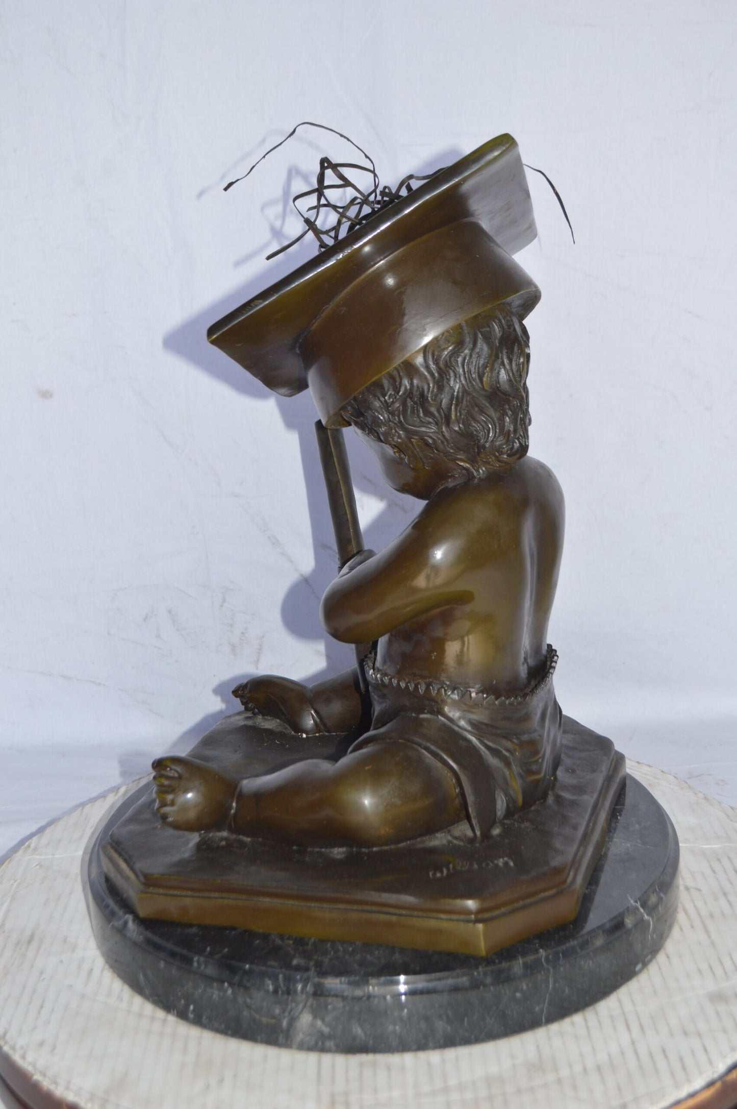 Graduating baby bronze statue - Size: 16"L x 16"W x 21"H.