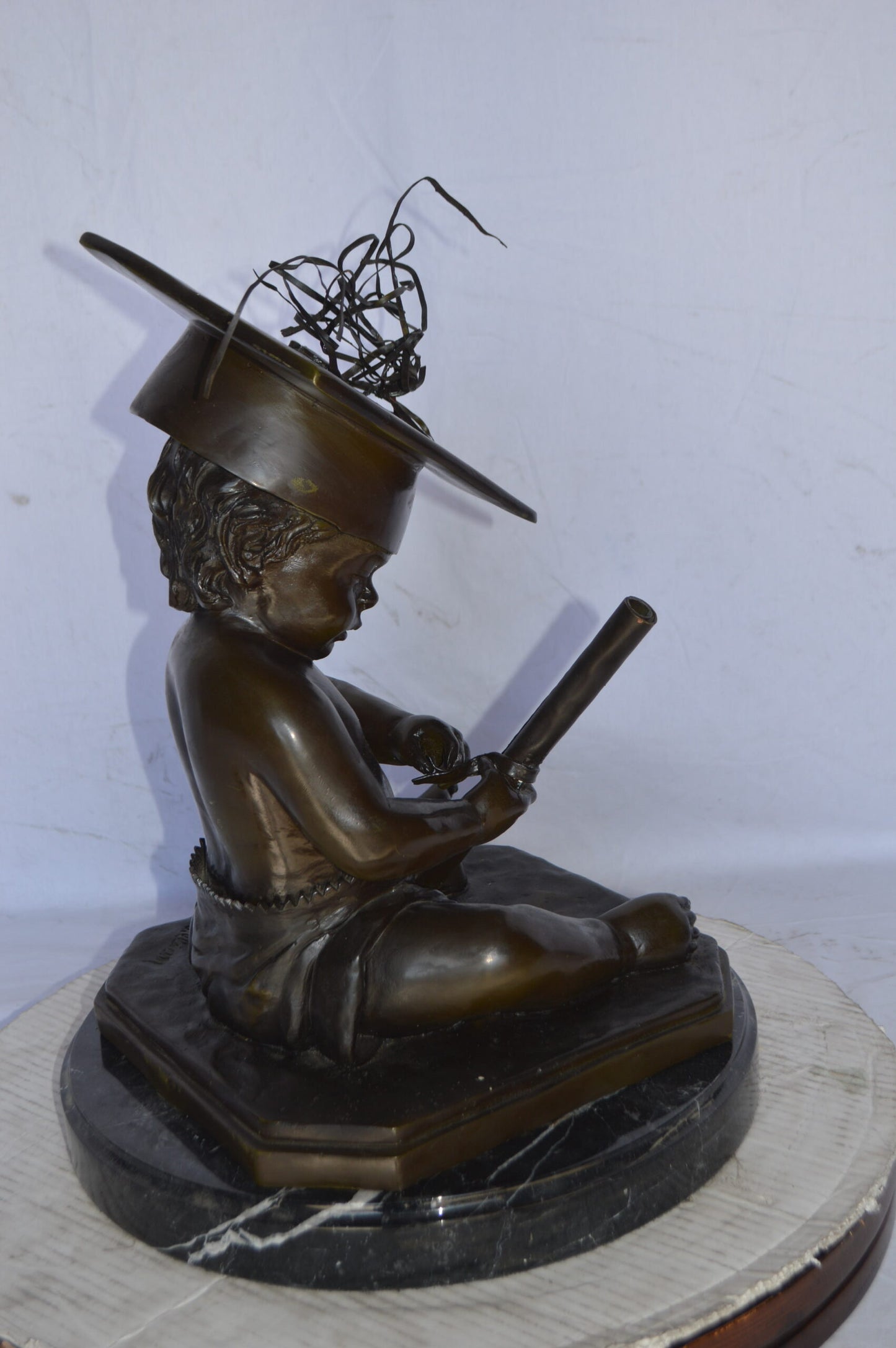 Graduating baby bronze statue - Size: 16"L x 16"W x 21"H.