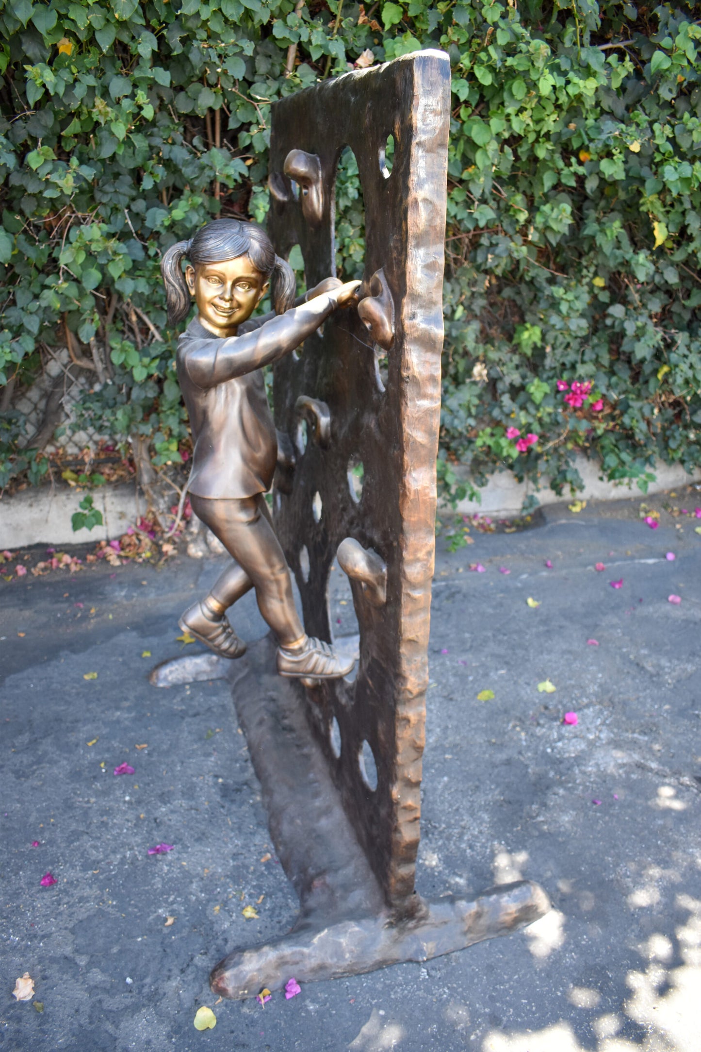 Young Girl Playing on A Climbing Wall Bronze Statue Life Size 44" x 26" x 57"H