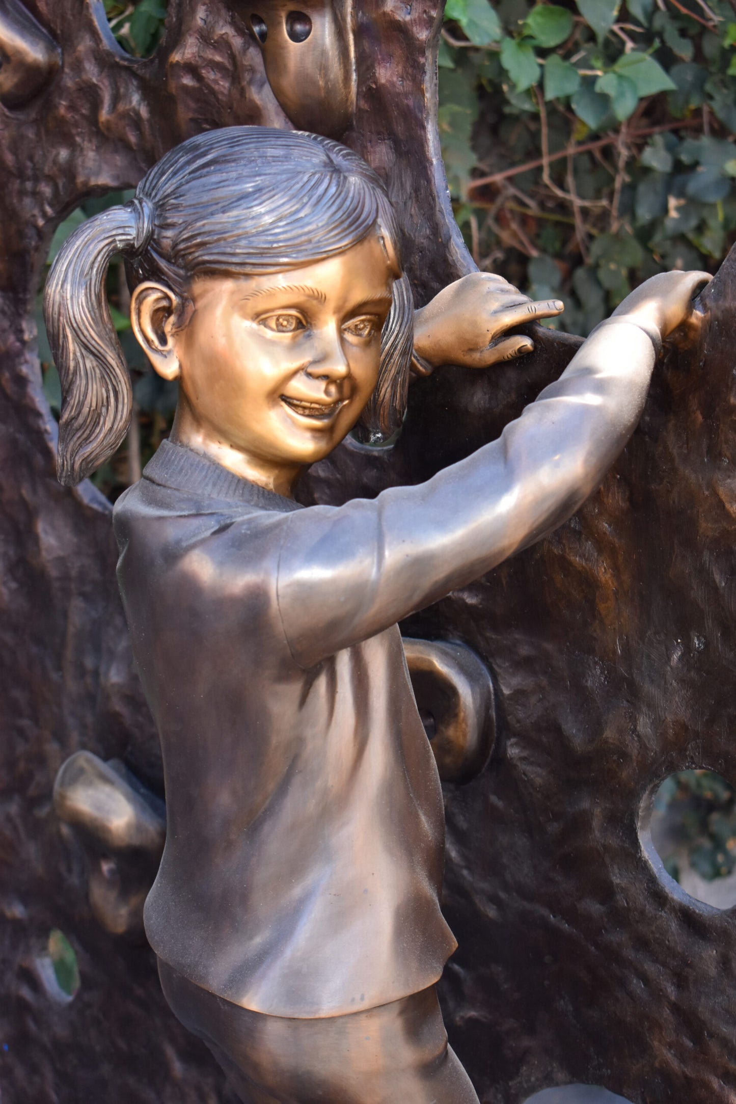 Young Girl Playing on A Climbing Wall Bronze Statue Life Size 44" x 26" x 57"H