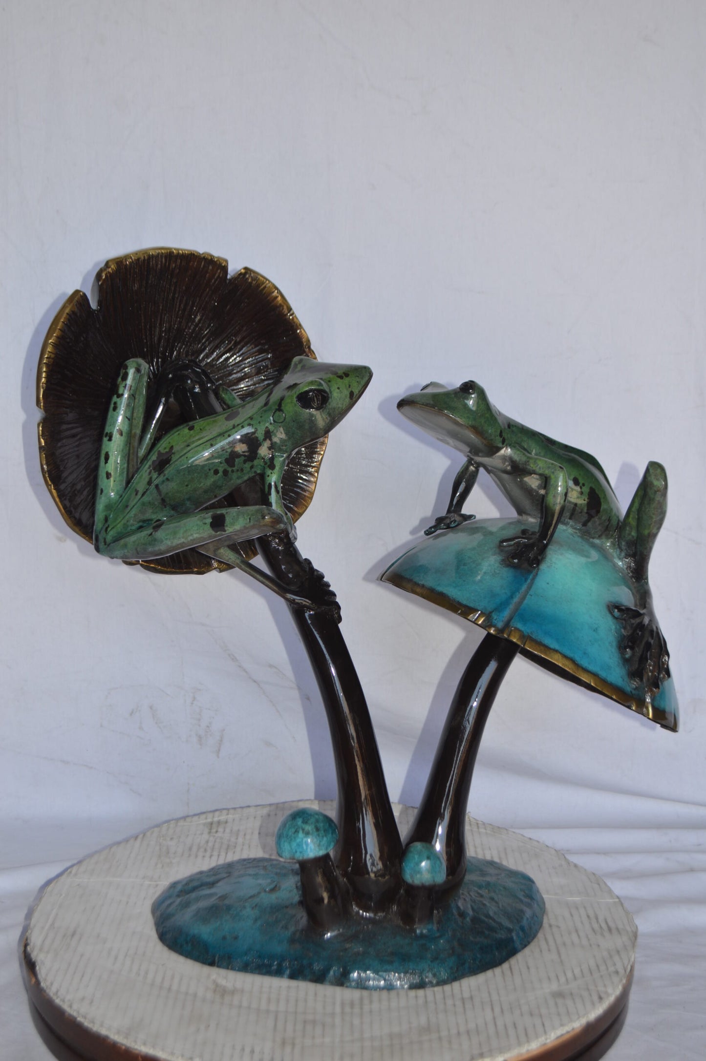 Two Frogs on a Mushroom Bronze Statue - Size: 24"L x 15"W x 27"H.