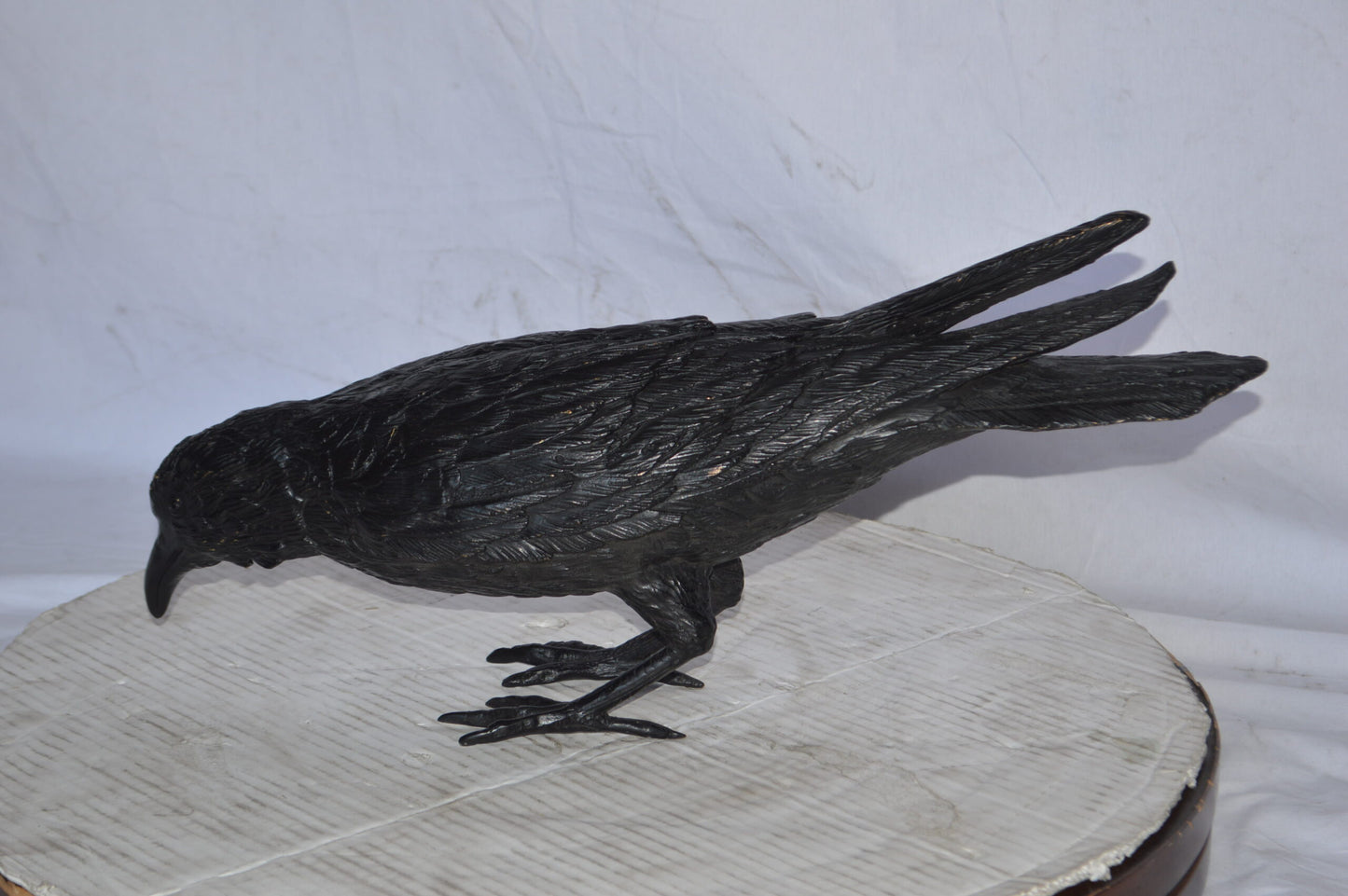 Raven with his head down Bronze Statue - Size: 22"L x 6"W x 11"H.