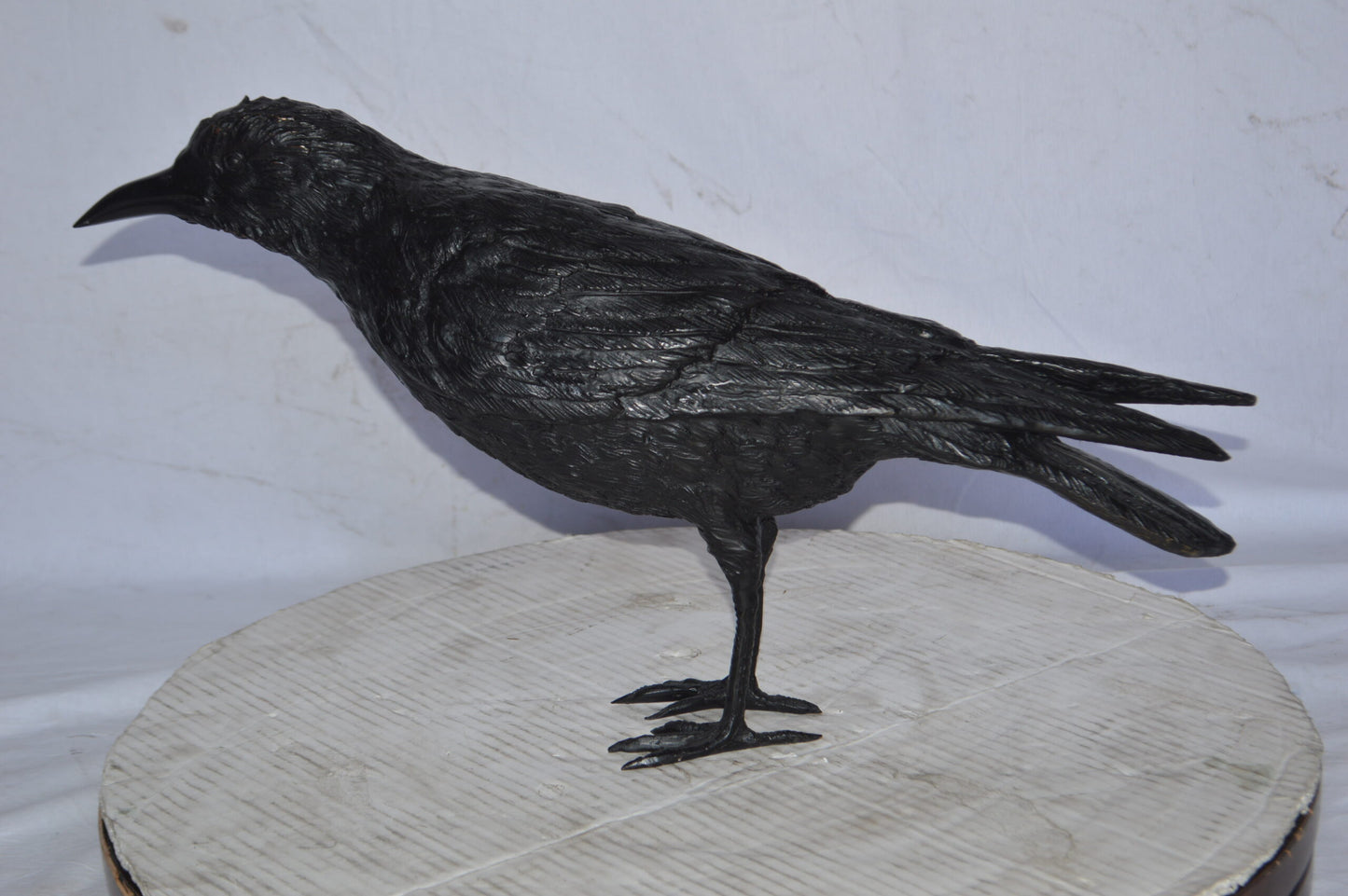 Raven with his head up Bronze Statue - Size: 23"L x 6"W x 13"H.
