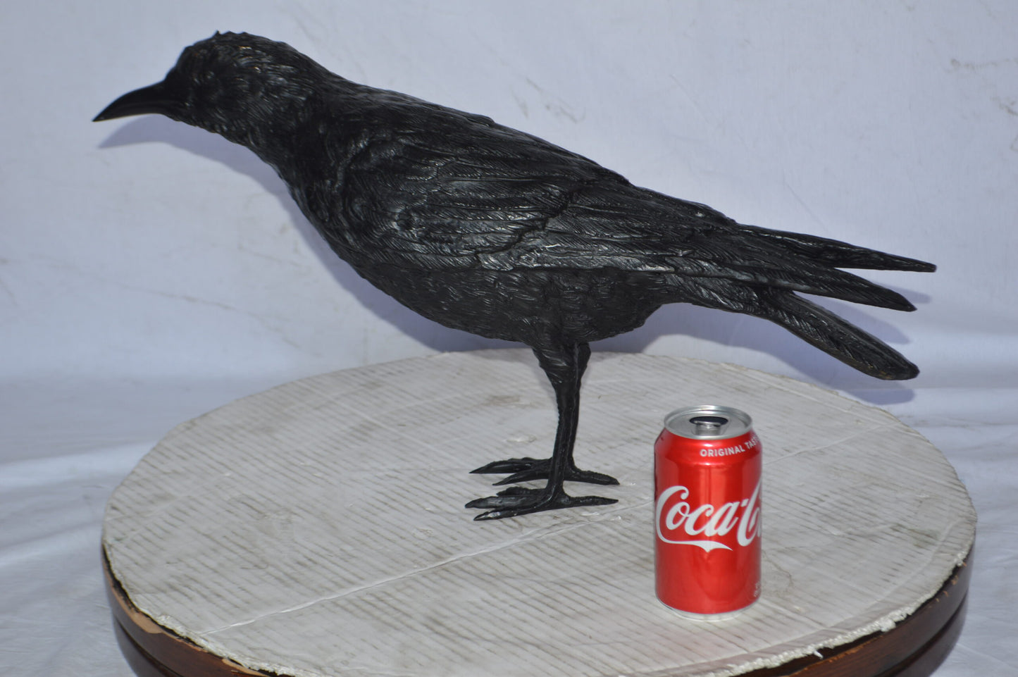 Raven with his head up Bronze Statue - Size: 23"L x 6"W x 13"H.