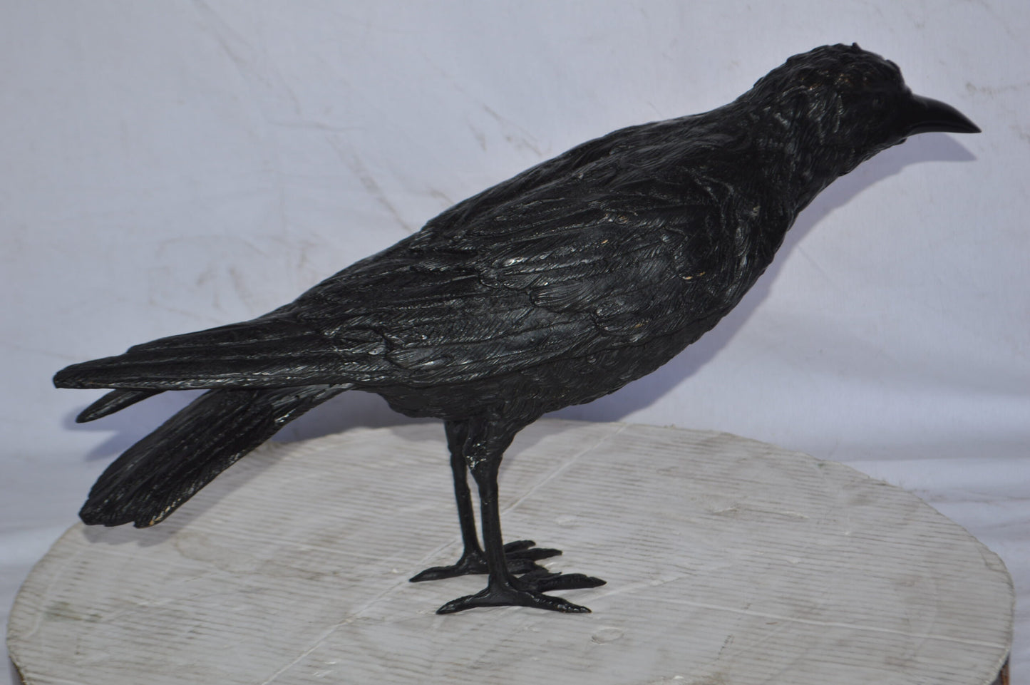 Raven with his head up Bronze Statue - Size: 23"L x 6"W x 13"H.