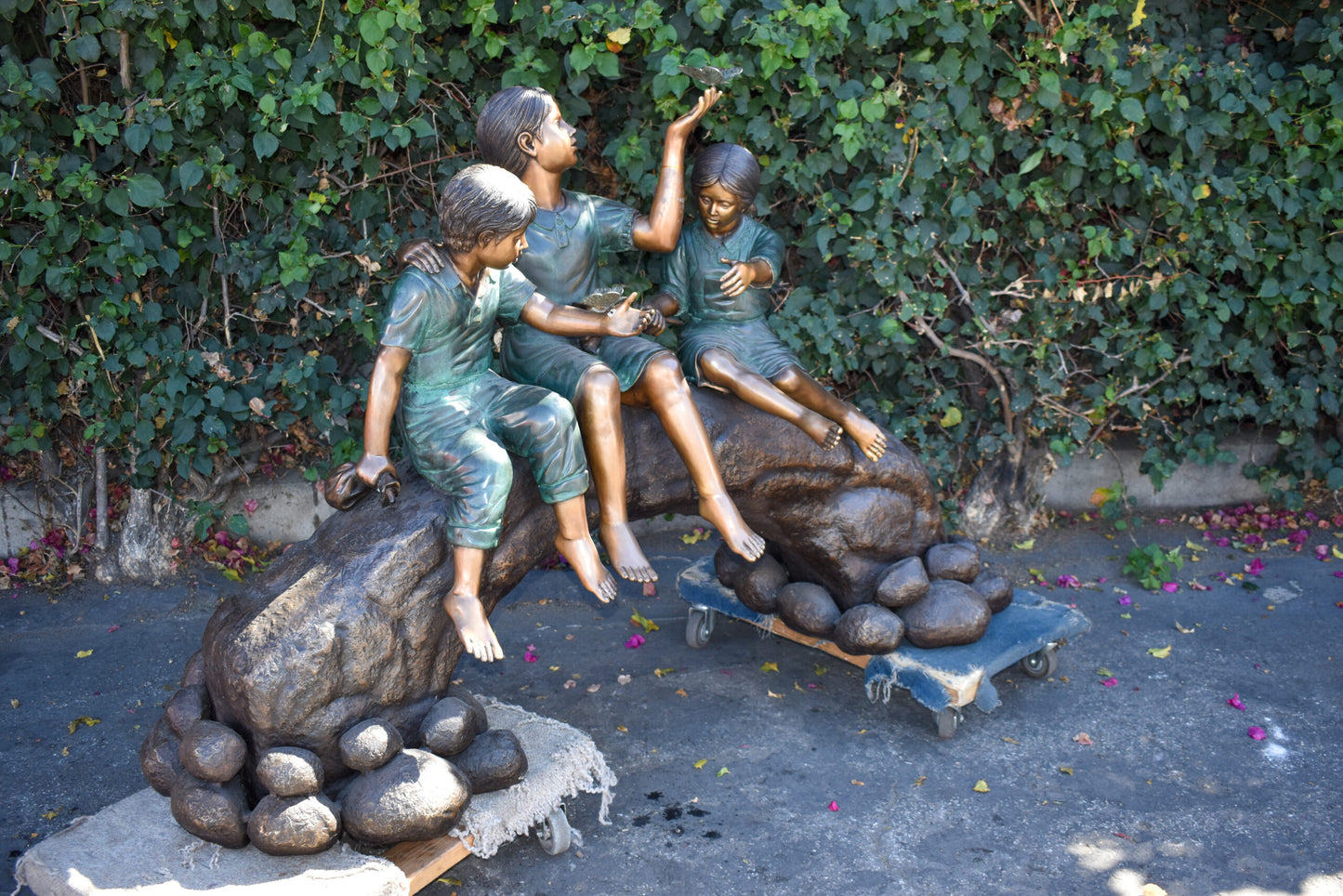 Three Kids Playing With Butterflies Bronze Statue - Size: 70"L x 25"W x 45"H.