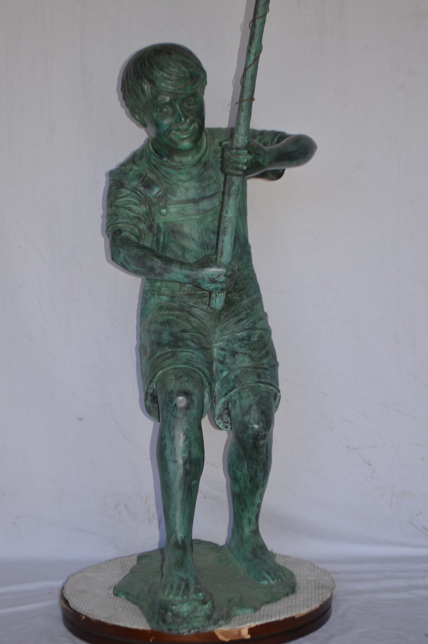 Young Boy Fishing Bronze Statue - green patina - Size: 16"L x 54"W x 62"H.