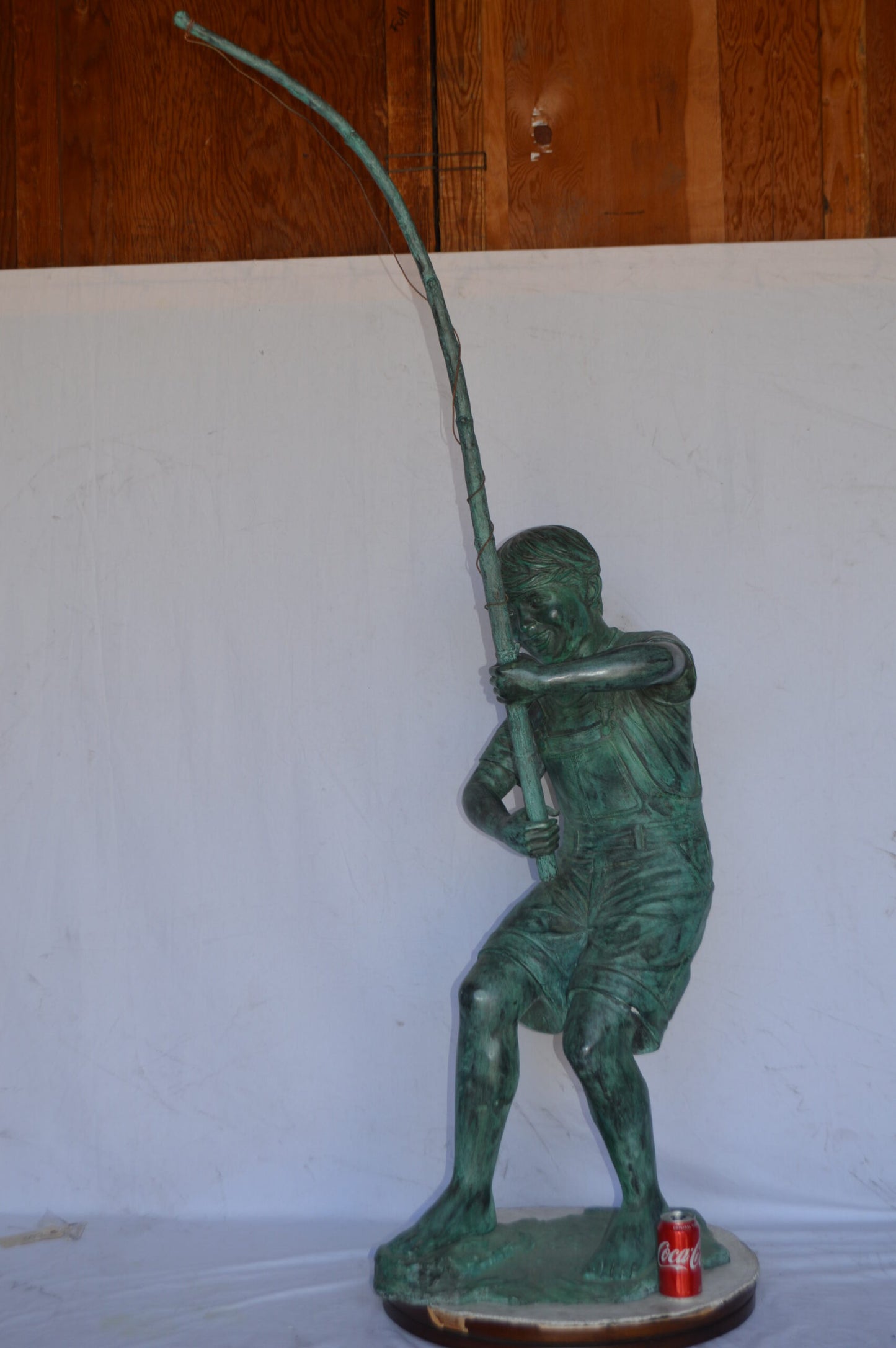Young Boy Fishing Bronze Statue - green patina - Size: 16"L x 54"W x 62"H.