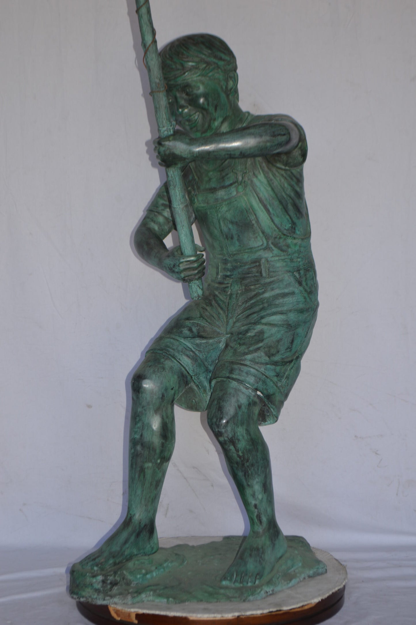 Young Boy Fishing Bronze Statue - green patina - Size: 16"L x 54"W x 62"H.