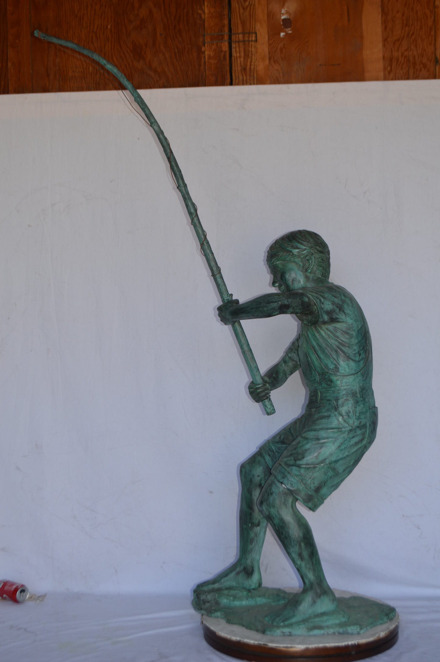 Young Boy Fishing Bronze Statue - green patina - Size: 16"L x 54"W x 62"H.