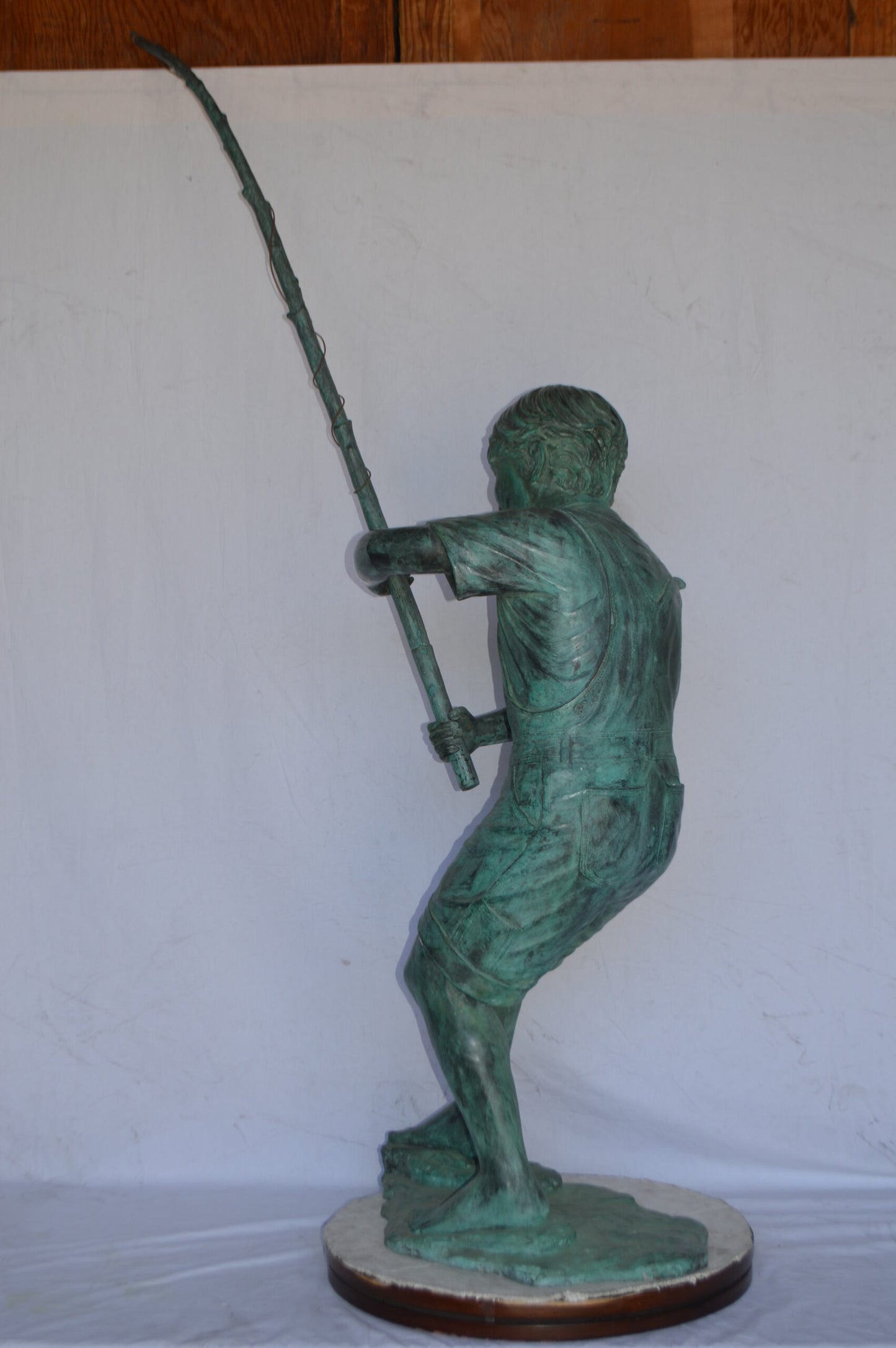 Young Boy Fishing Bronze Statue - green patina - Size: 16"L x 54"W x 62"H.