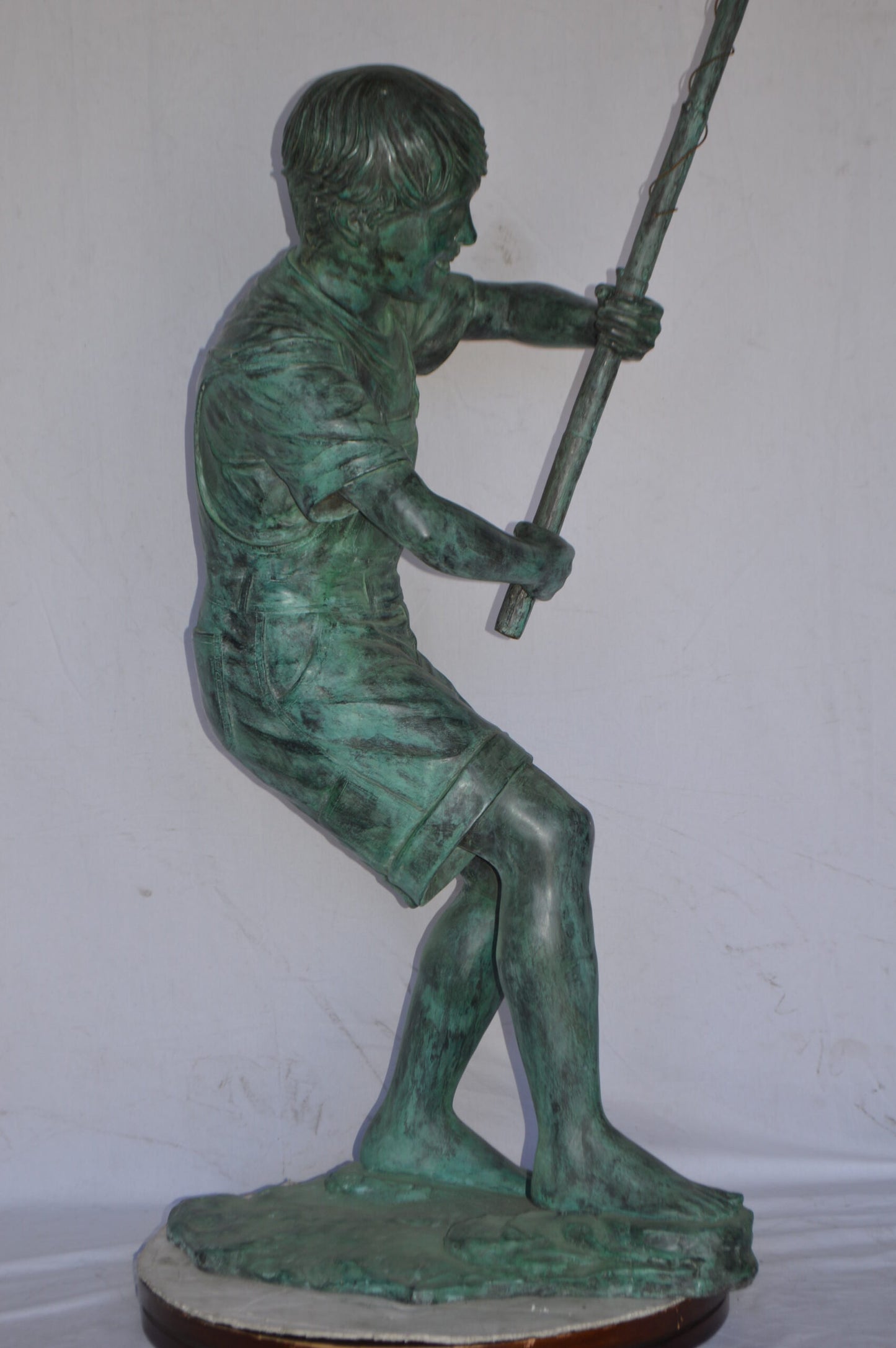 Young Boy Fishing Bronze Statue - green patina - Size: 16"L x 54"W x 62"H.