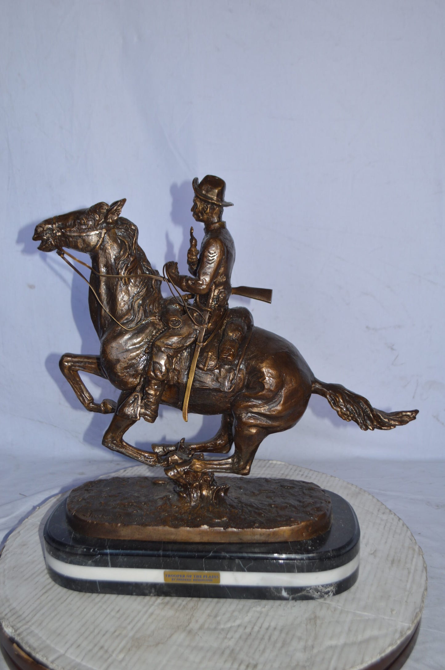 Trooper of the plains Bronze replica by Remington - Size: 20"L x 8"W x 21"H.