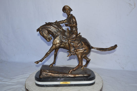 Cowboy Bronze replica by Fredric Remington - Size: 25"L x 9"W x 23"H.