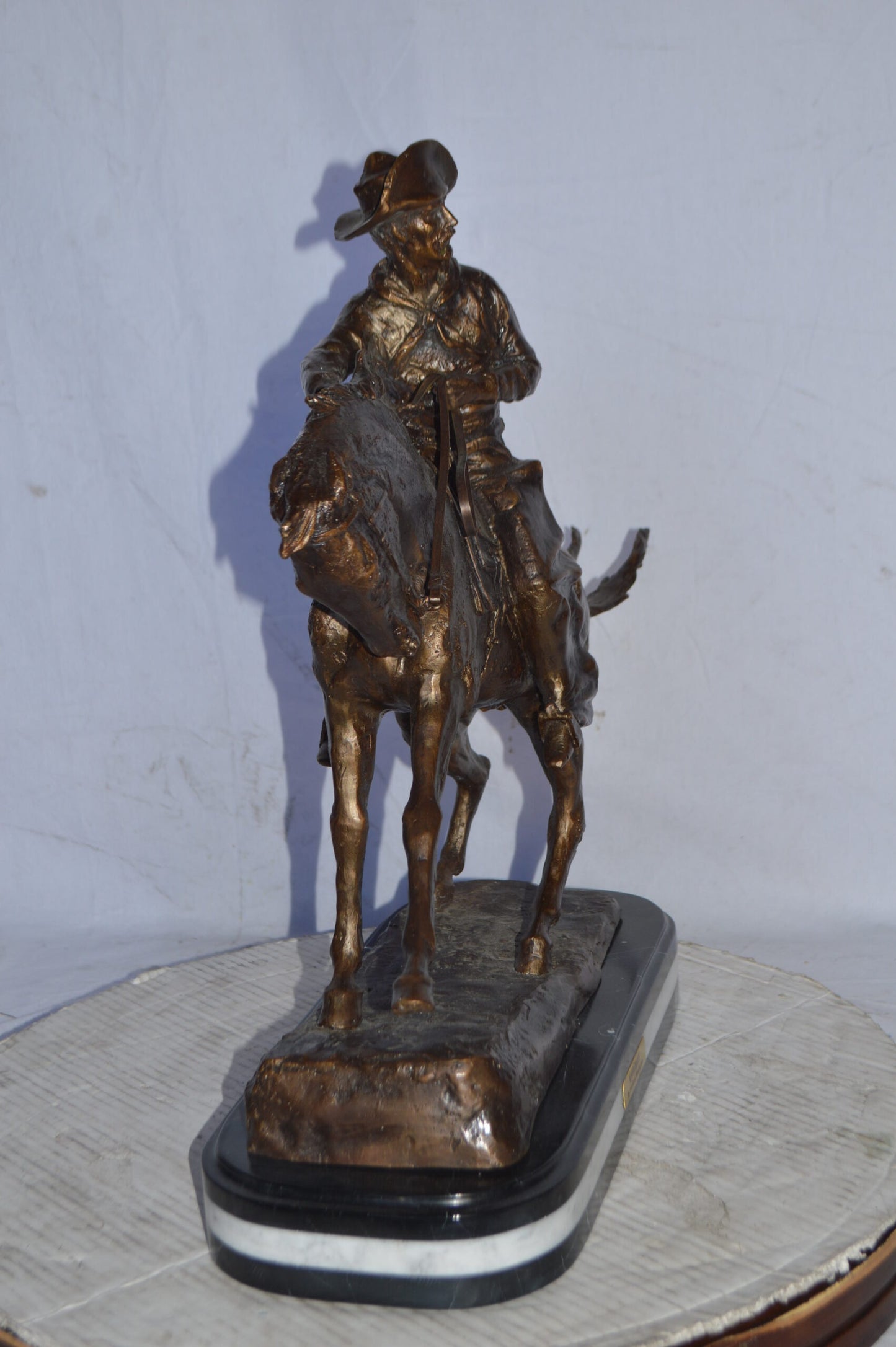 Cowboy Bronze replica by Fredric Remington - Size: 25"L x 9"W x 23"H.