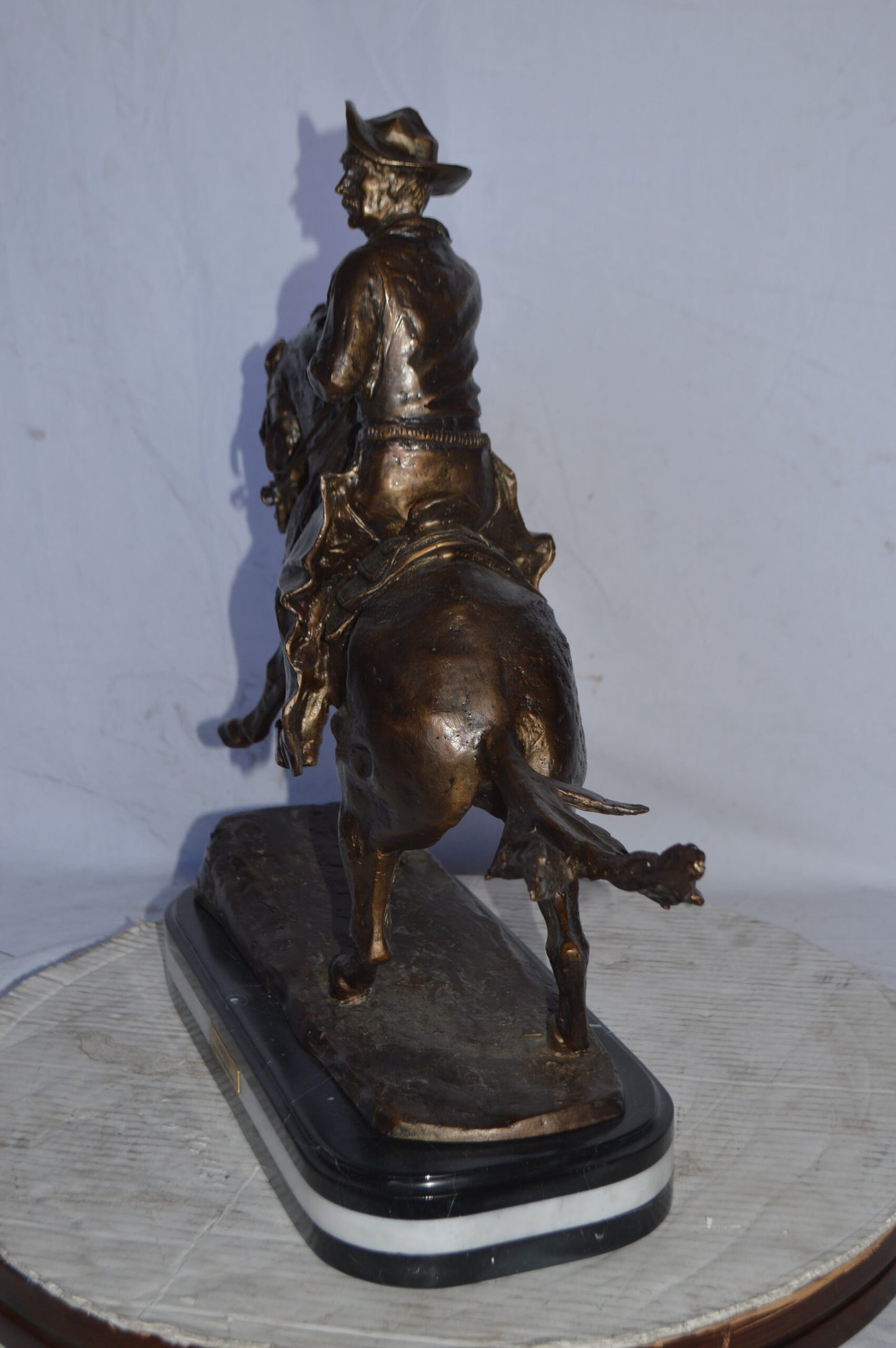 Cowboy Bronze replica by Fredric Remington - Size: 25"L x 9"W x 23"H.