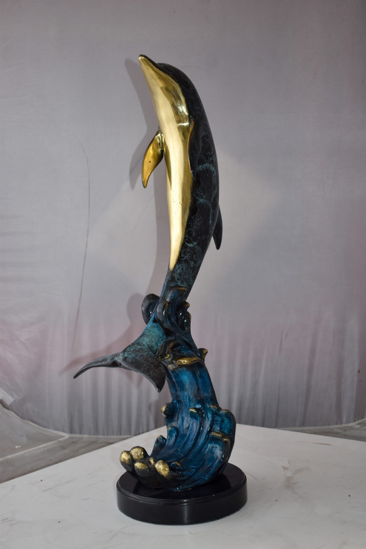 Dolphin Jumping the Waves Colored Bronze Statue Size: 15" x 10" x 31"H