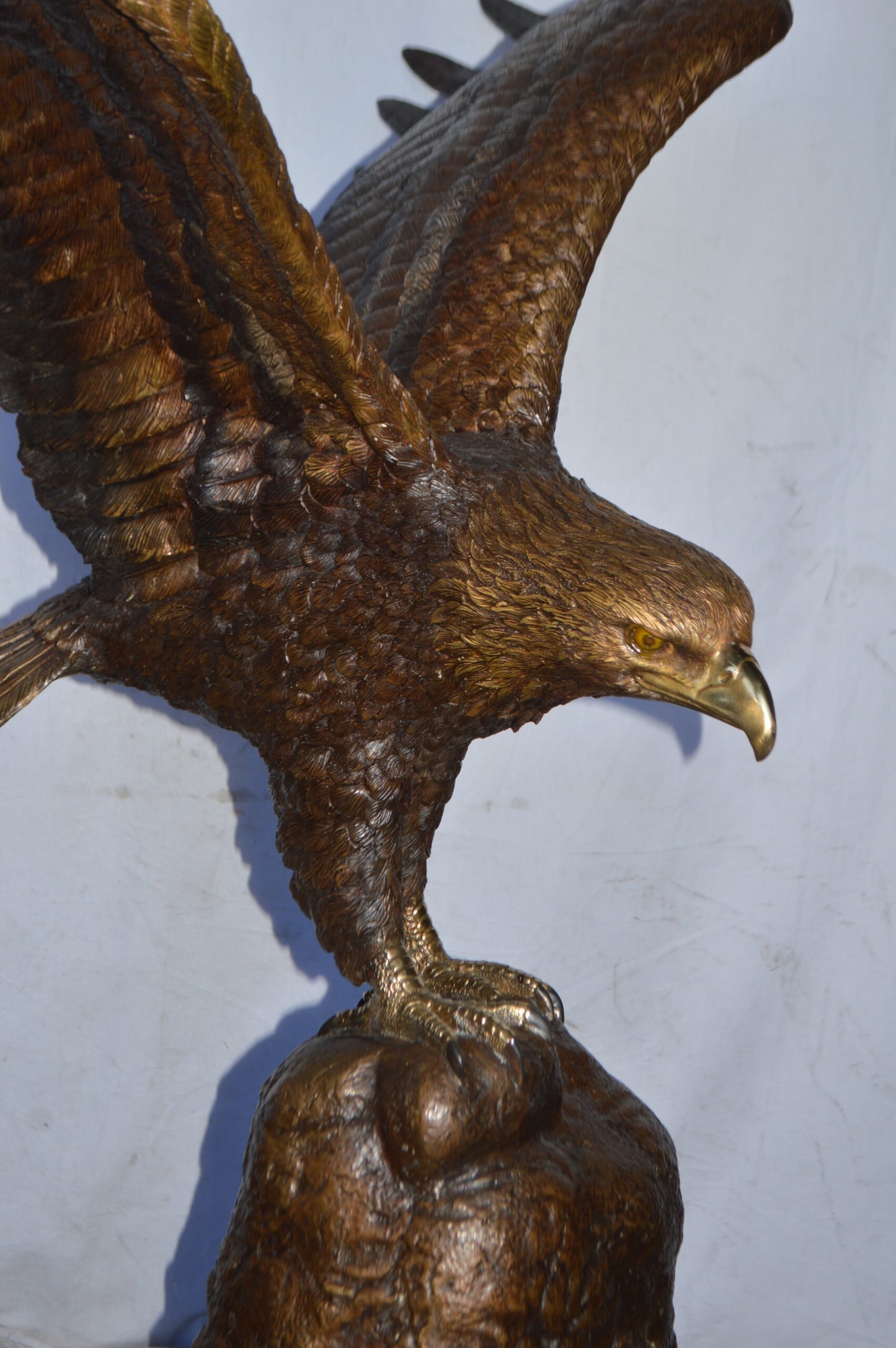 Eagle Landing on a Rock Bronze Statue - Size: 51"L x 36"W x 58"H.