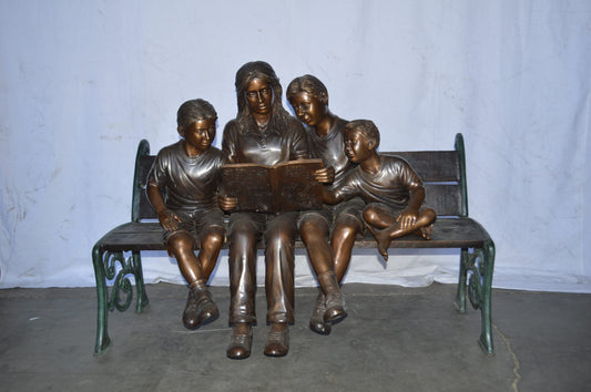 Mom and boys reading stories on bench bronze statue - Size: 53"L x 33"W x 39"H.