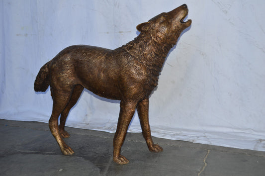 Wolf Standing and Howling Life Size Bronze Statue - Size: 45"L x 15"W x 34"H.