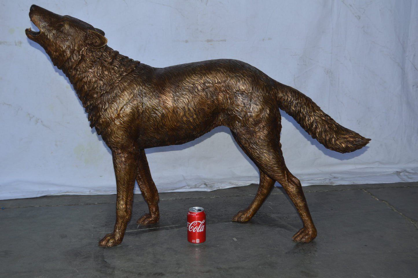 Wolf Standing and Howling Life Size Bronze Statue - Size: 45"L x 15"W x 34"H.