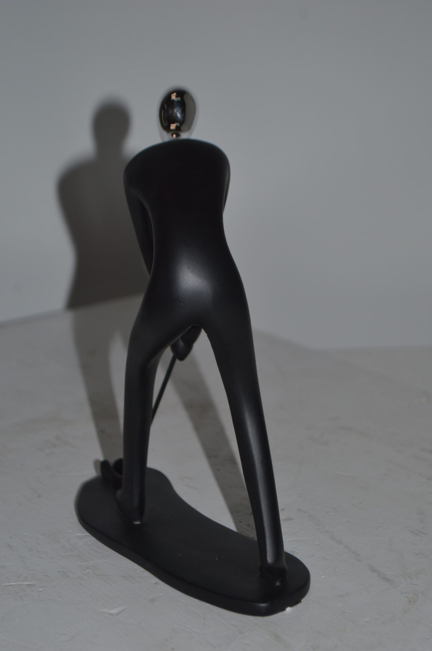 Modern art Black Golfer with Silver Head Resin Statue - Size: 7"L x 2"W x 9"H.