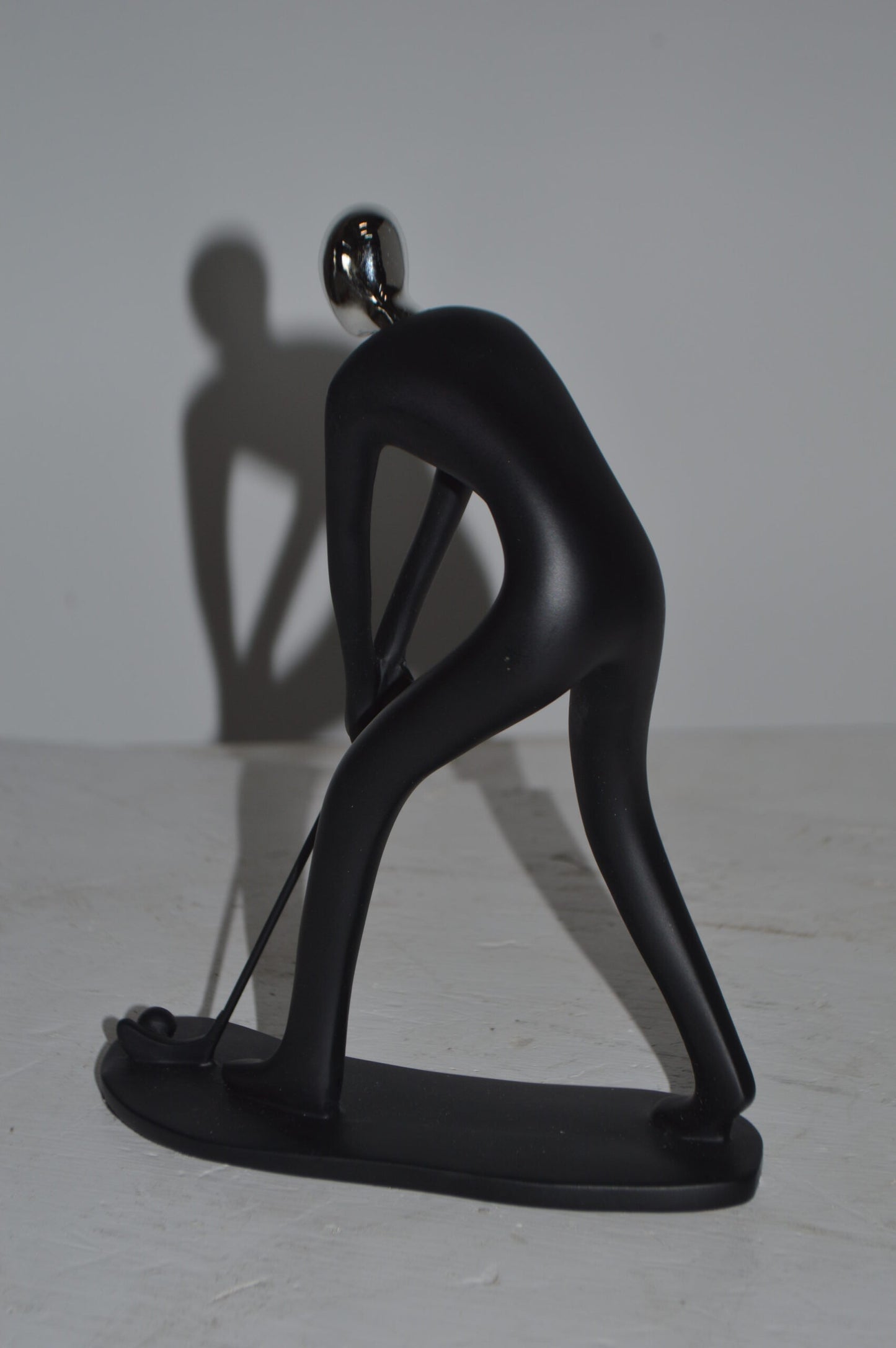 Modern art Black Golfer with Silver Head Resin Statue - Size: 7"L x 2"W x 9"H.
