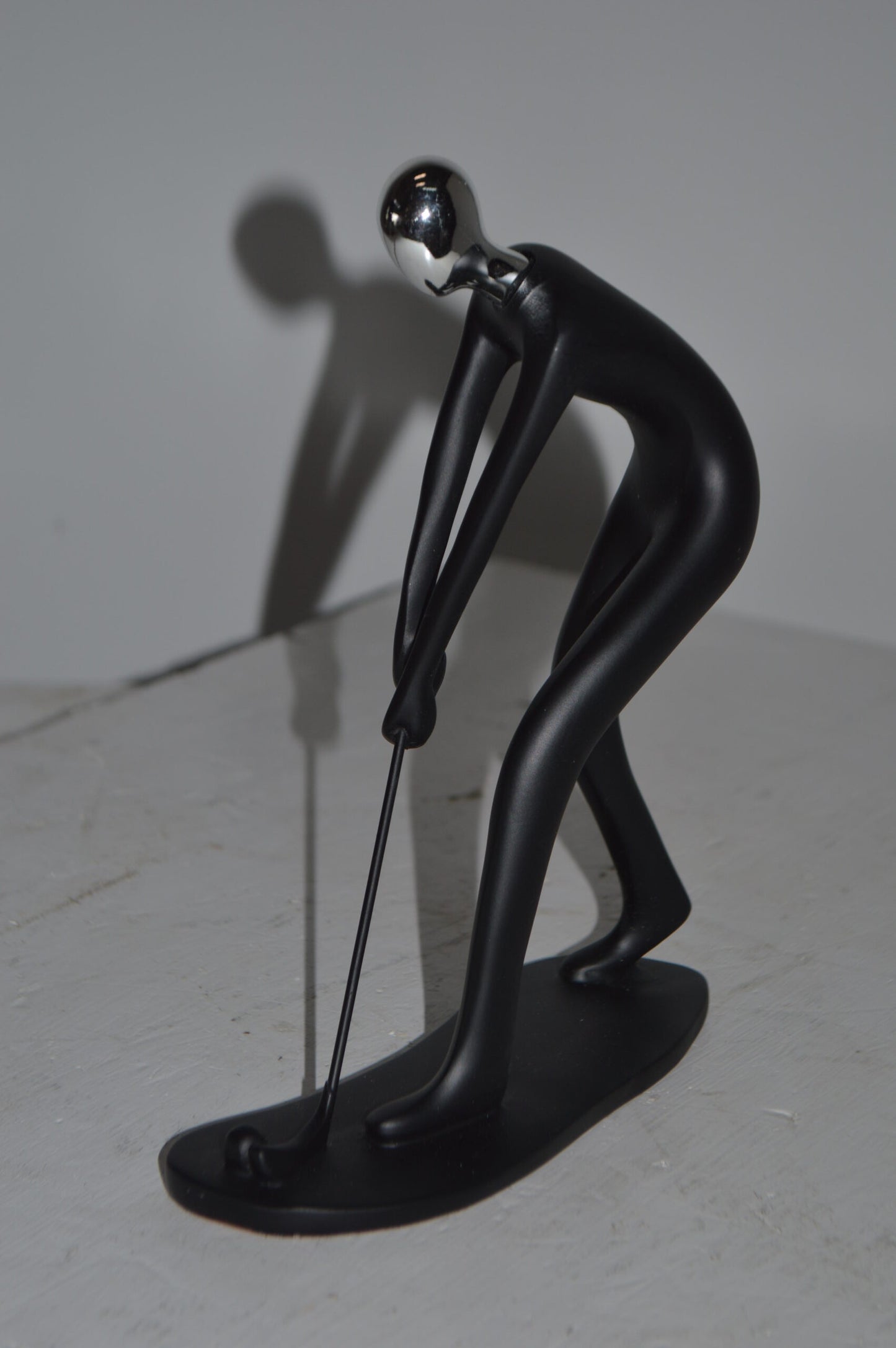 Modern art Black Golfer with Silver Head Resin Statue - Size: 7"L x 2"W x 9"H.